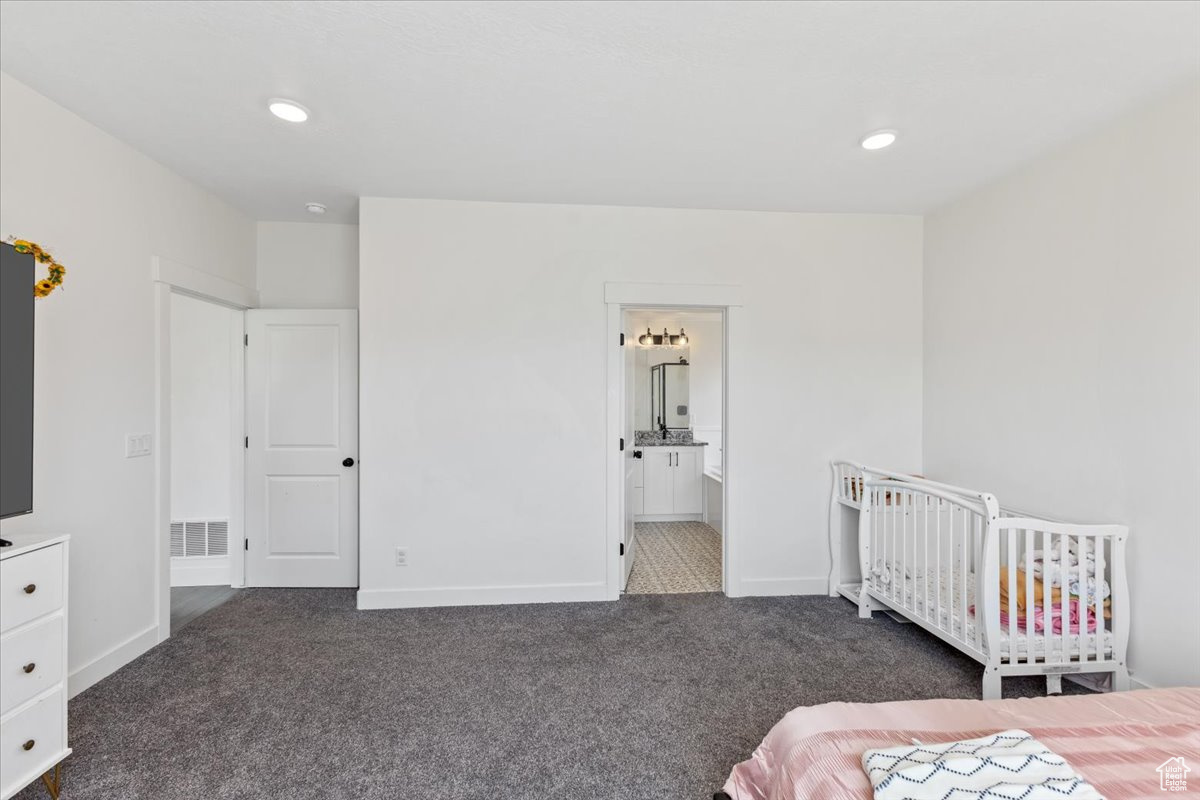 Primary bedroom featuring connected bathroom