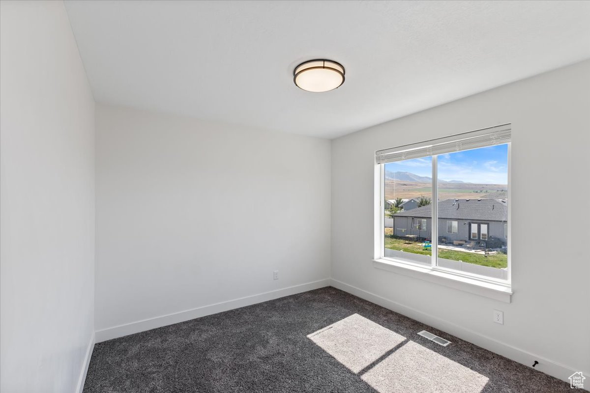 Empty room with carpet flooring