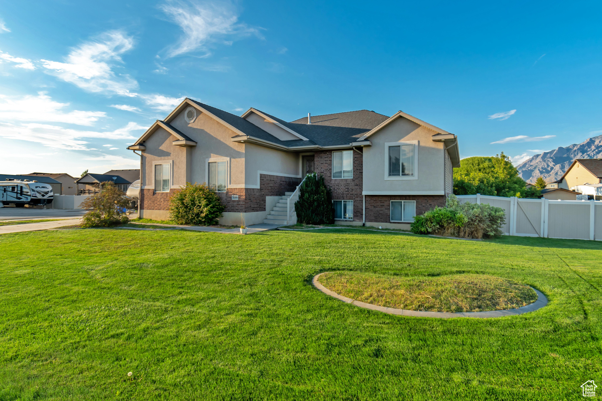 View of front of property with a front yard