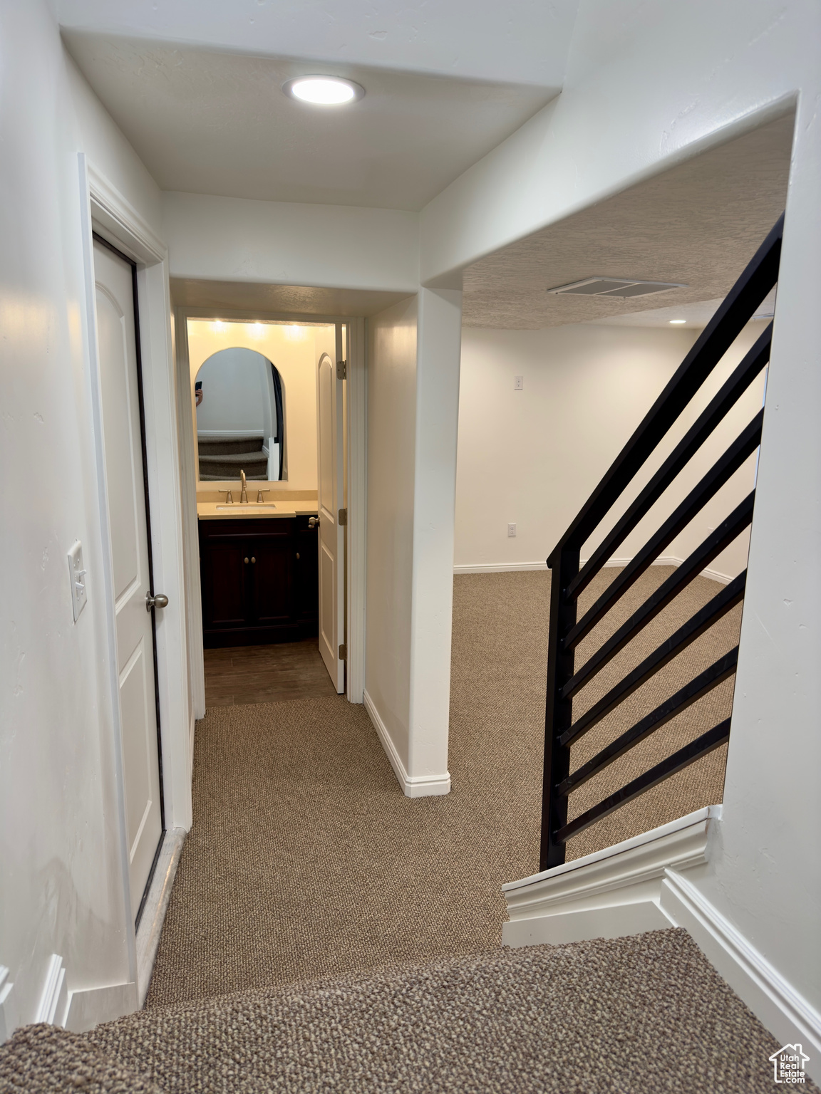 Stairs/hallway to the brand new basement bathroom & family room