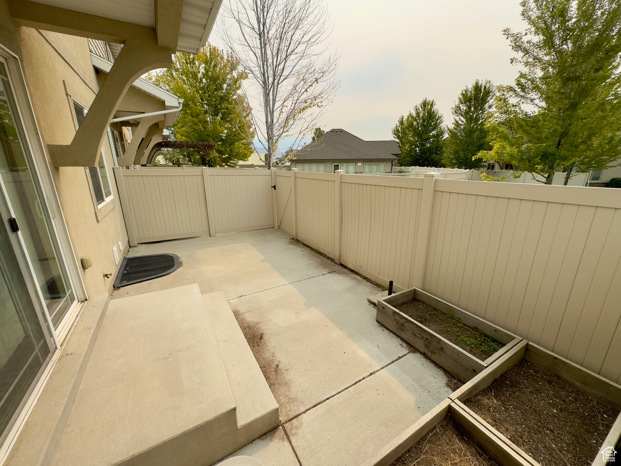 Fenced backyard with garden boxes