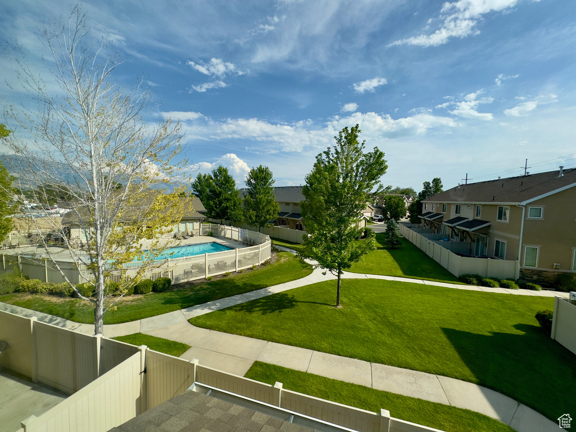 View of the pool & grassy area out the master bedroom window