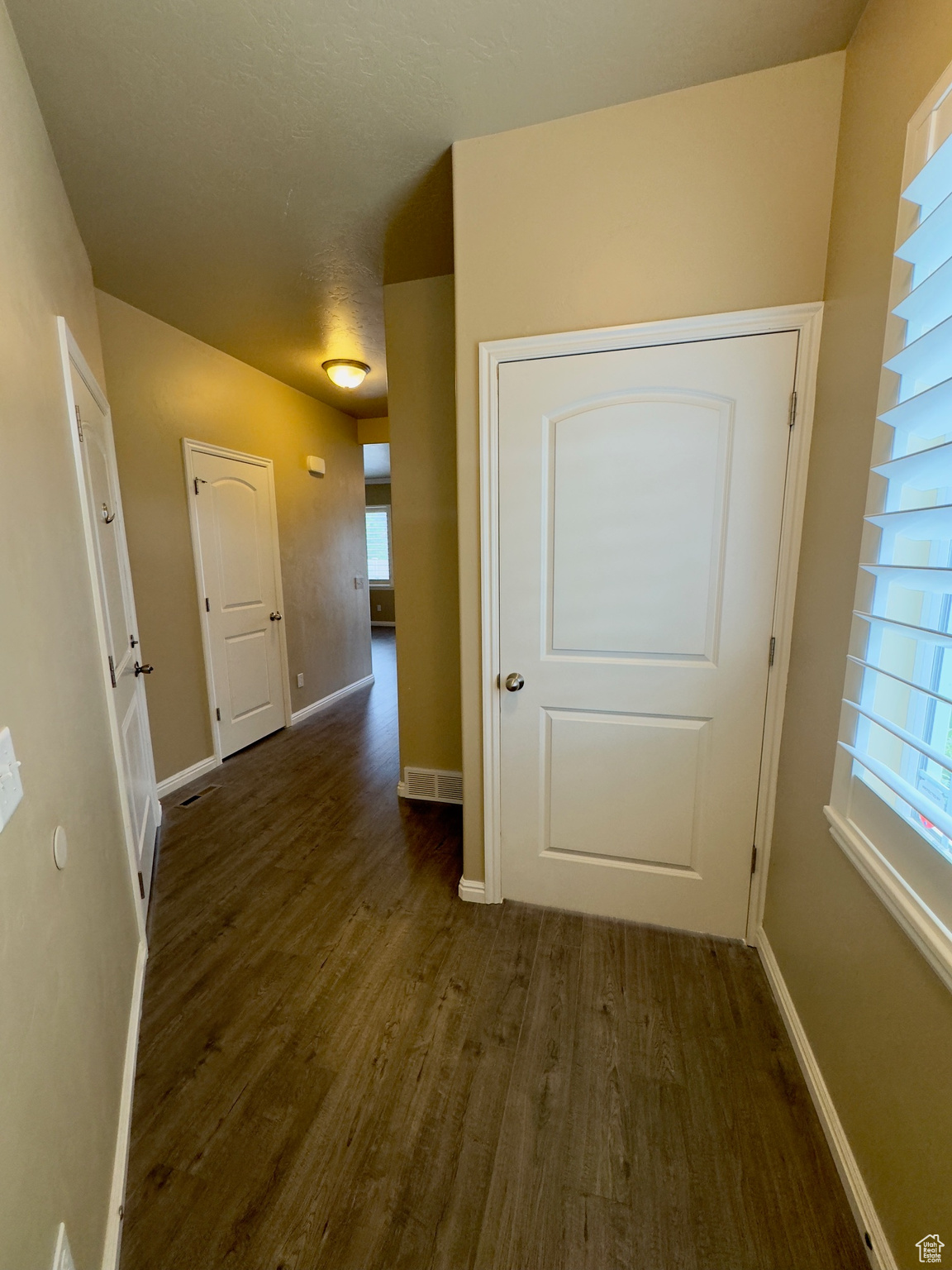 Entry from the front door. Door to the right goes to the basement.