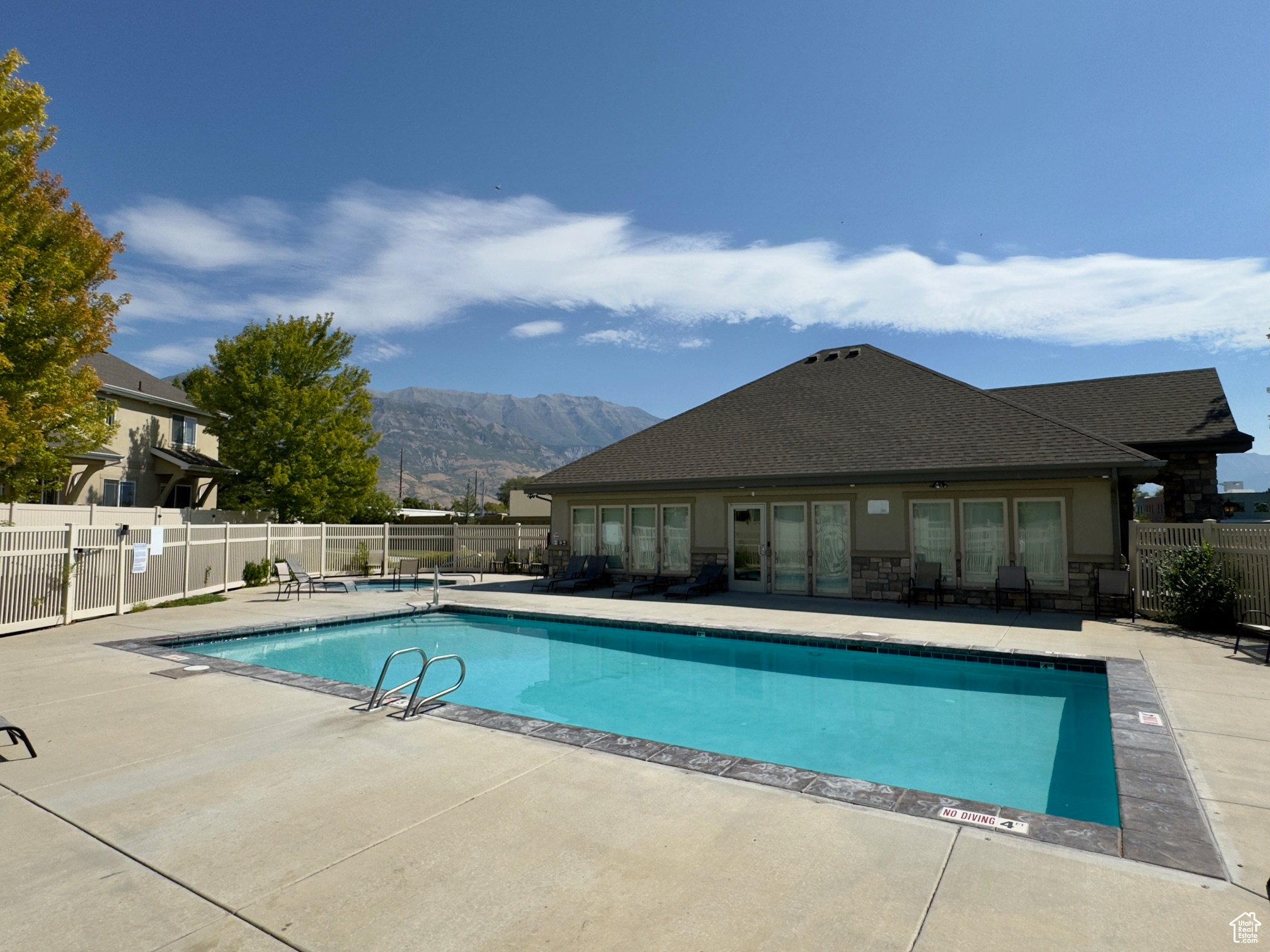 View of swimming pool with a mountain view and a patio area