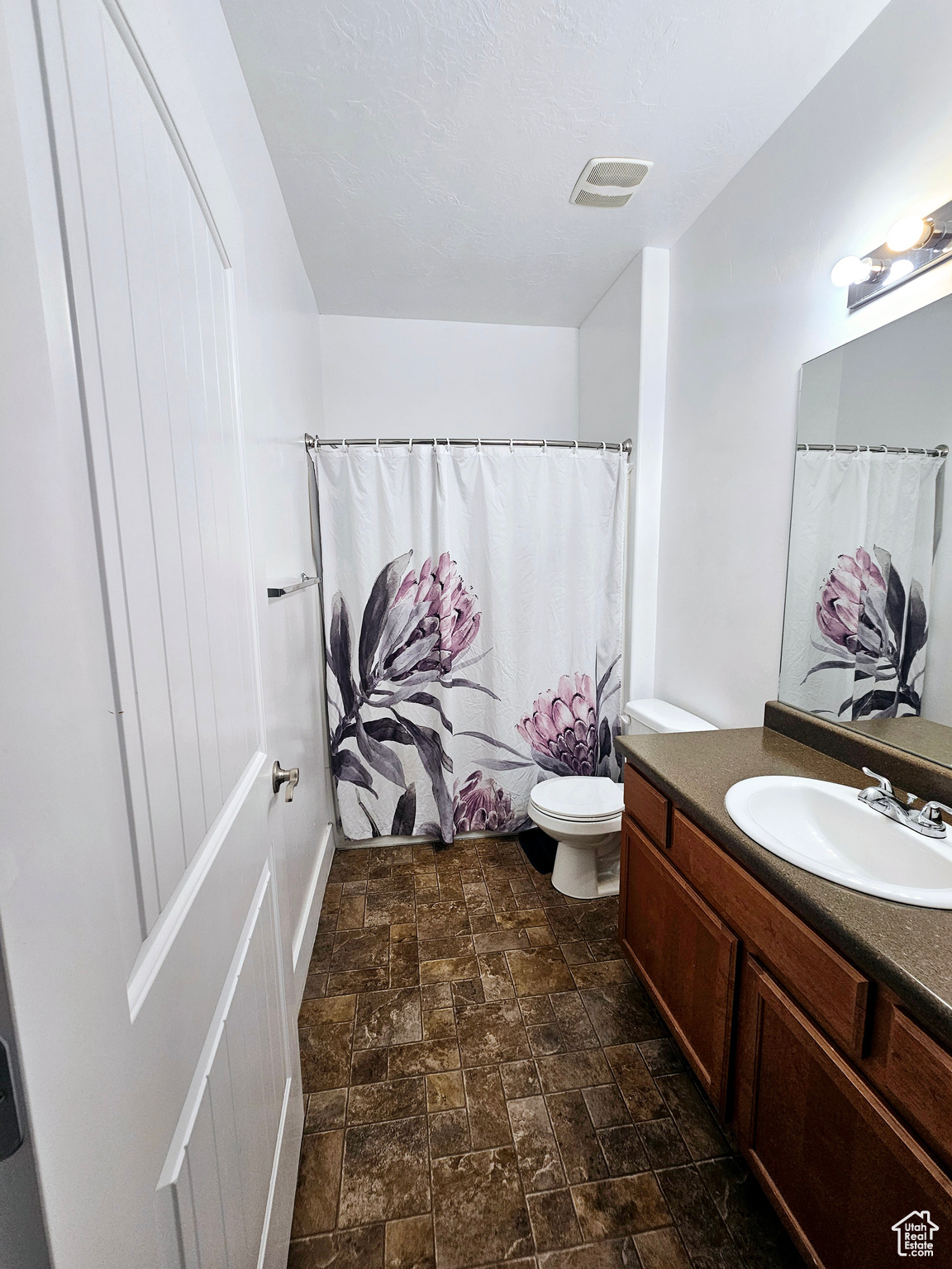 Bathroom featuring toilet and vanity