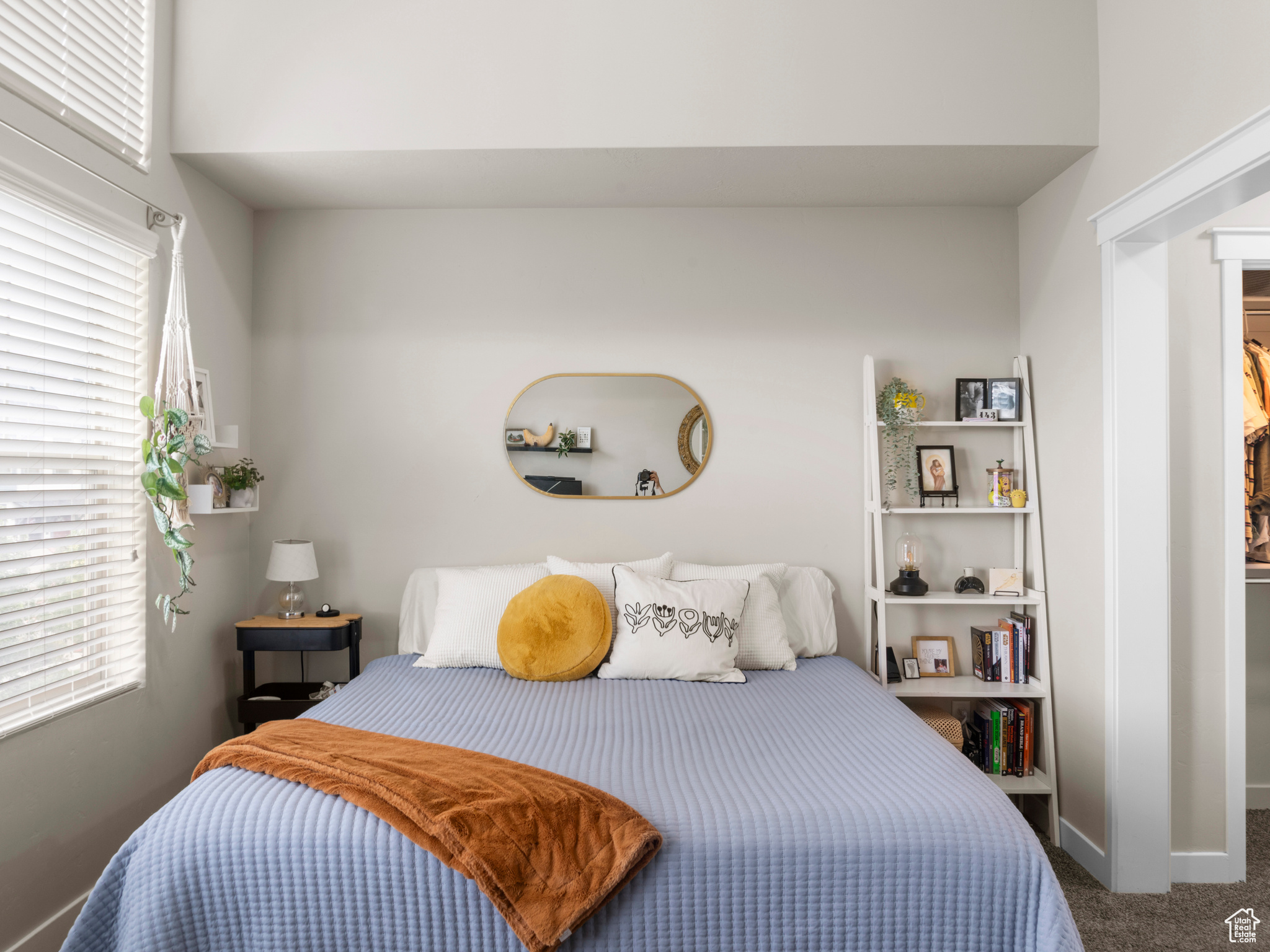 Primary Bedroom- featuring multiple windows and dark carpet