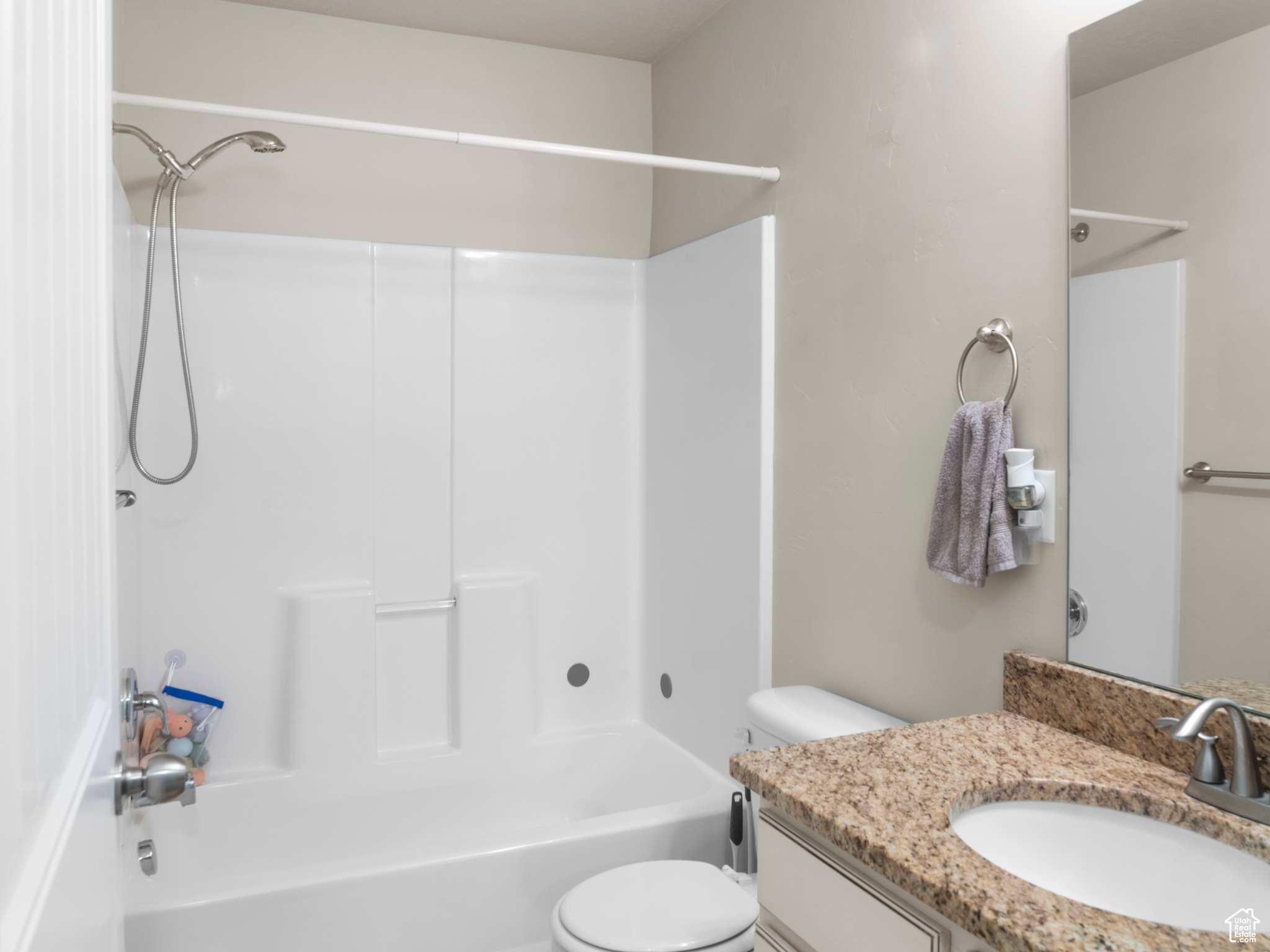 Full bathroom with vanity, toilet, and bathtub / shower combination