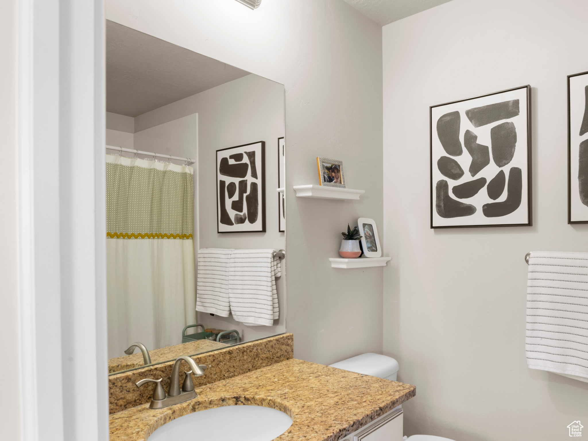 Bathroom featuring toilet and vanity