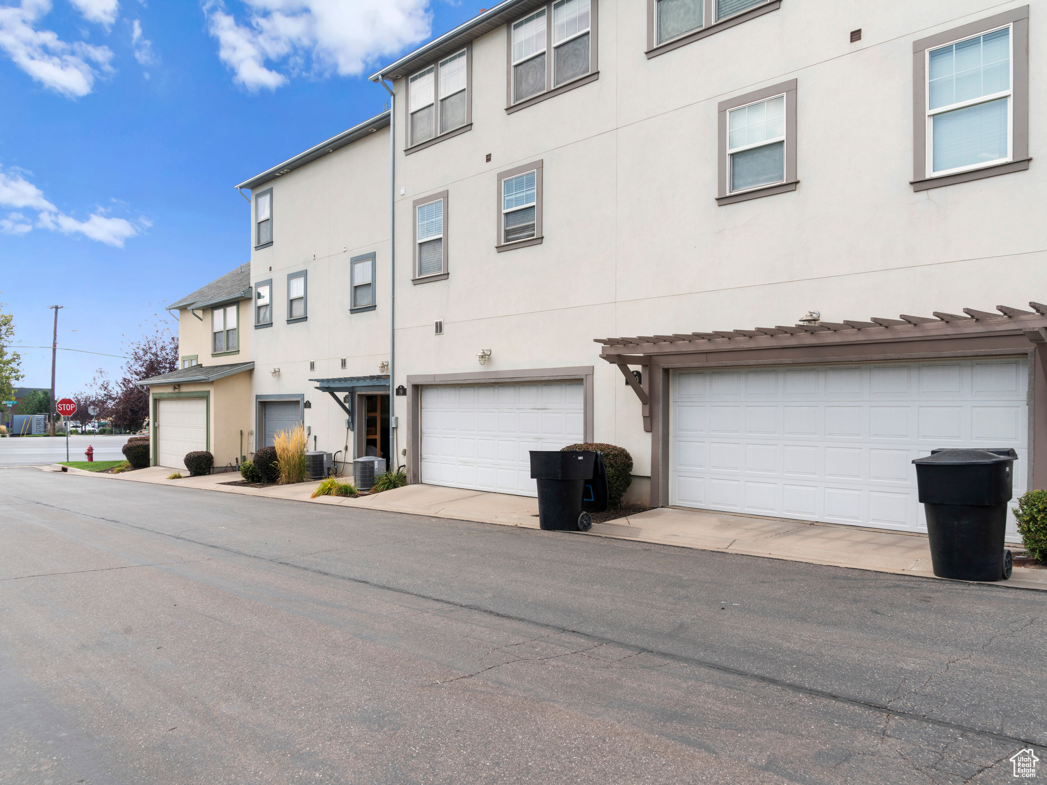 Exterior space featuring central air condition unit and a garage