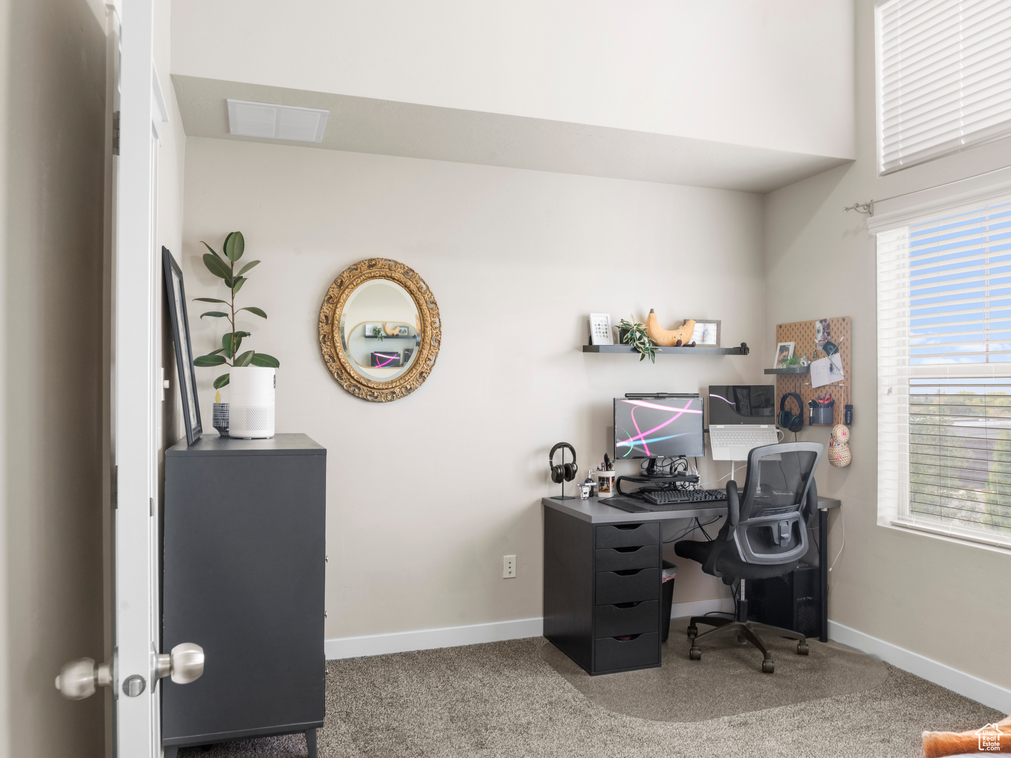 View of carpeted home office