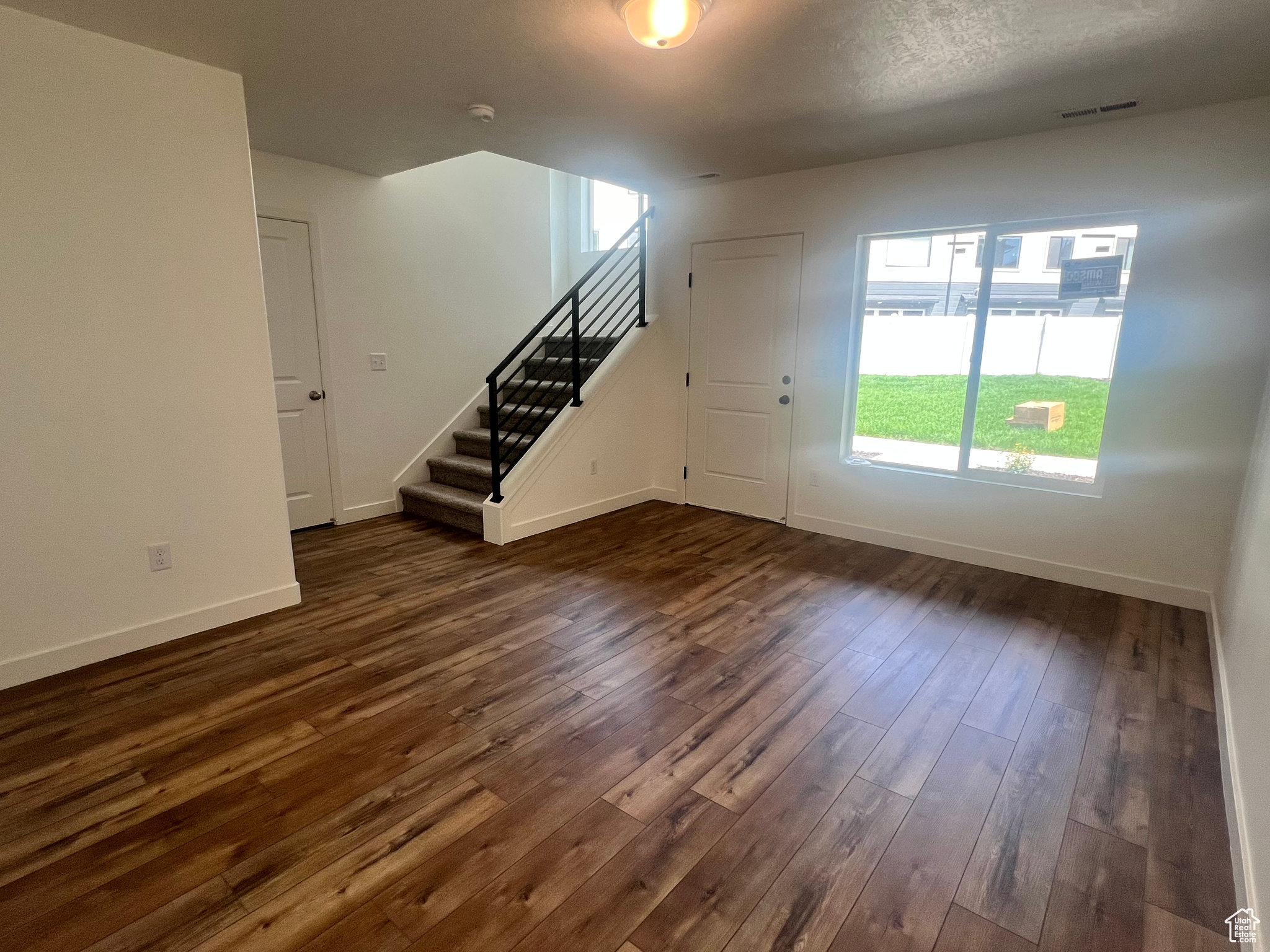 Foyer featuring dark hardwood / wood-style floors and a textured ceiling