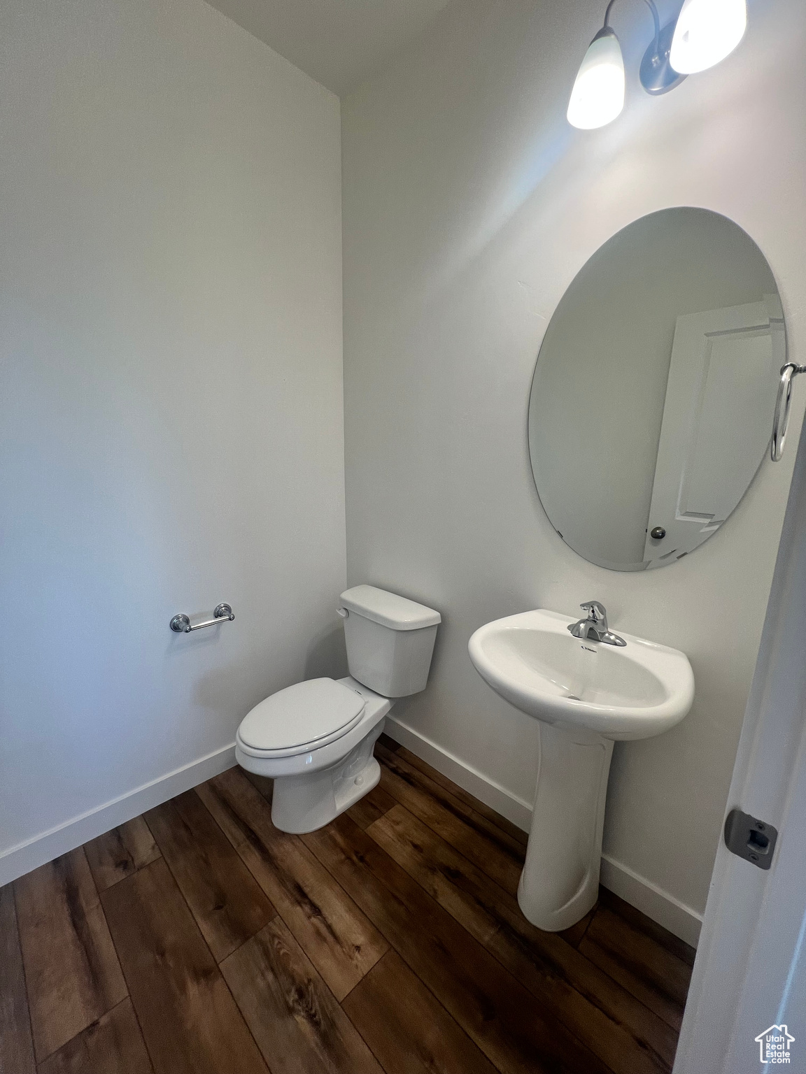 Bathroom featuring toilet and hardwood / wood-style flooring