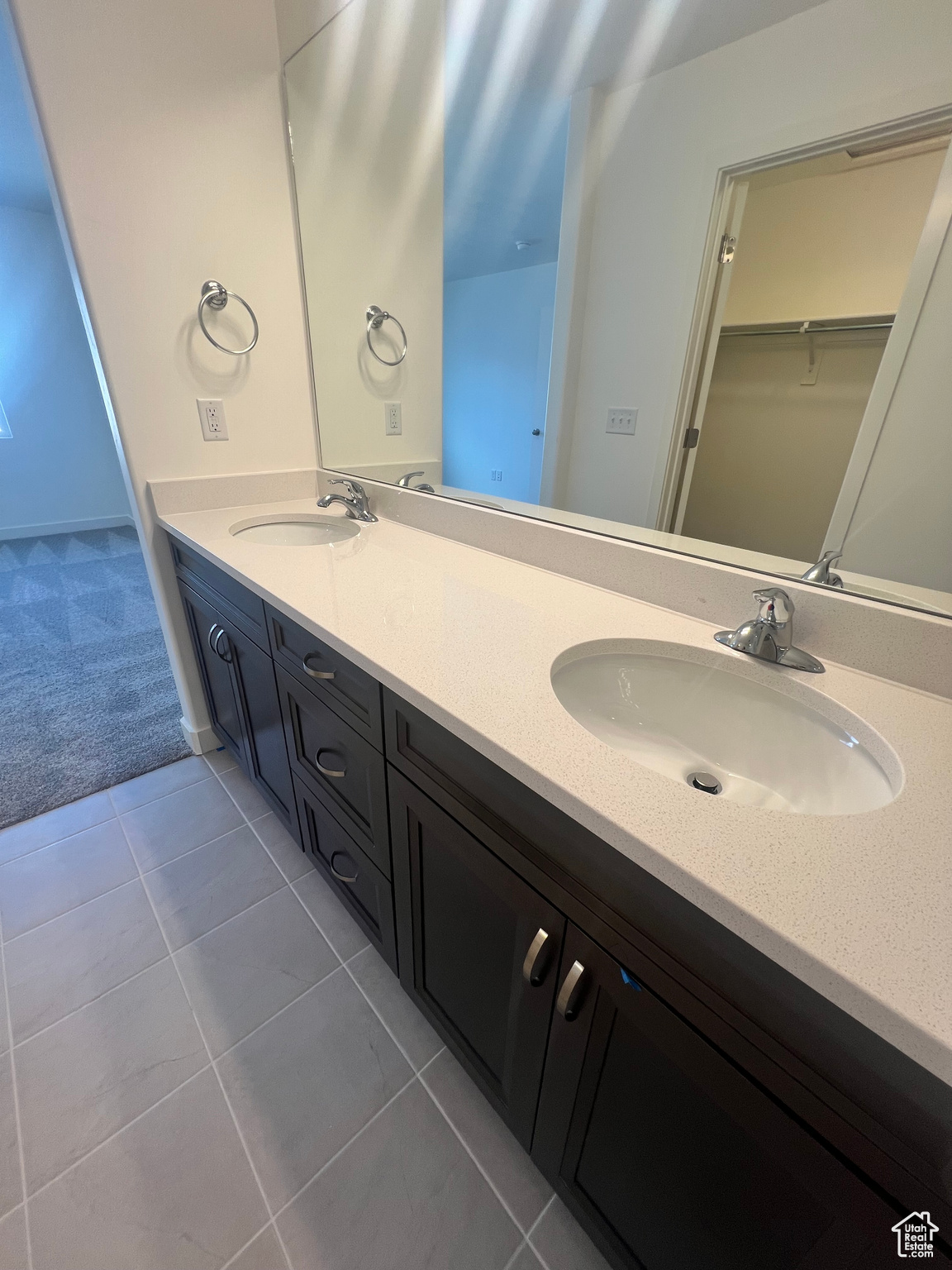 Bathroom featuring tile patterned flooring and vanity