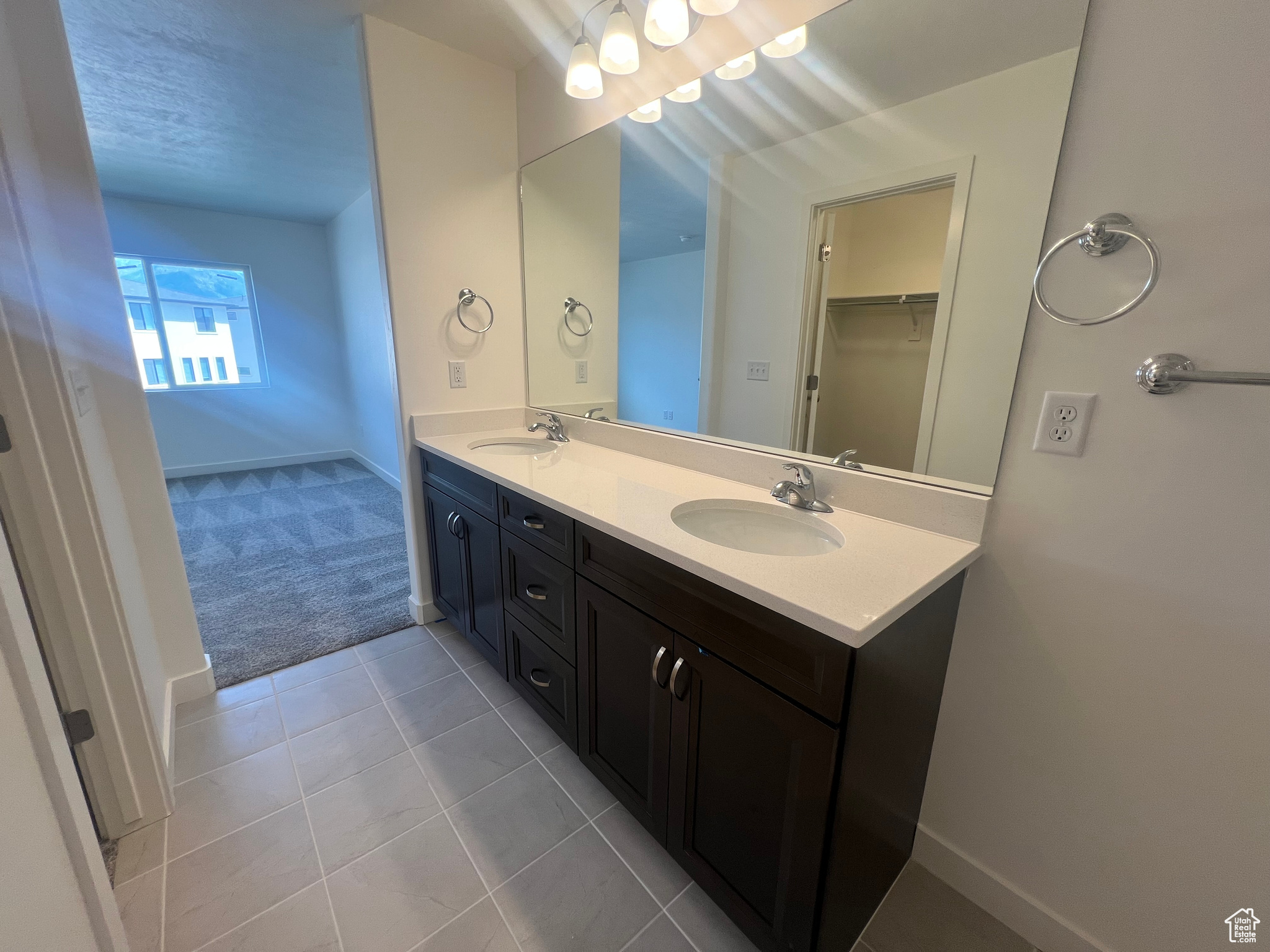 Bathroom featuring vanity and tile patterned floors