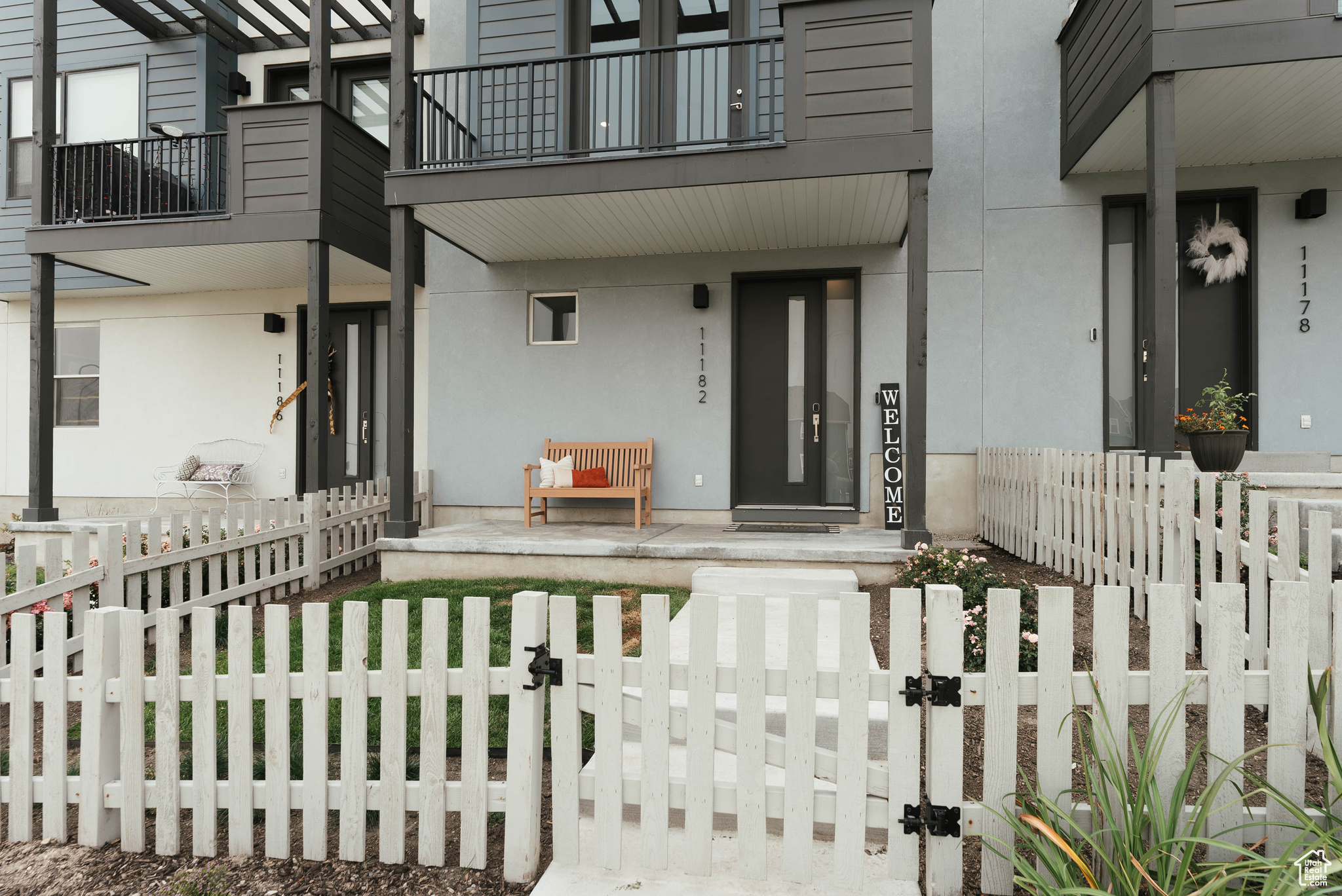 View of exterior entry with a balcony