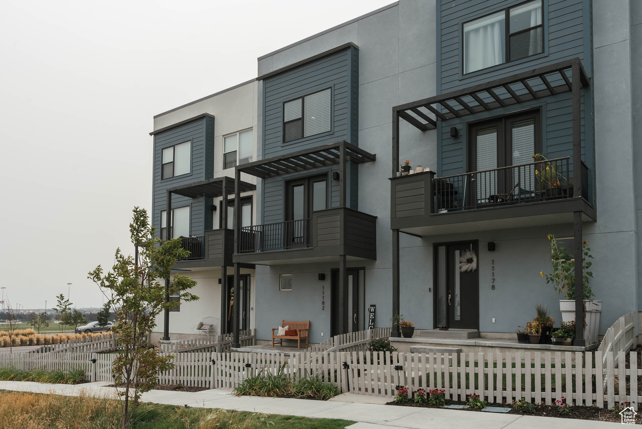 View of front of house with a balcony