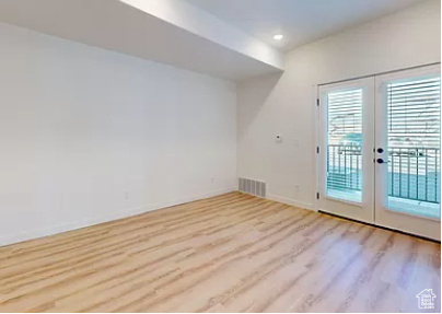 Doorway featuring french doors and hardwood / wood-style flooring