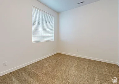 View of carpeted spare room