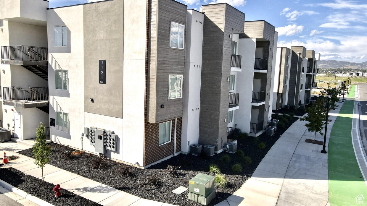 View of building exterior featuring a mountain view