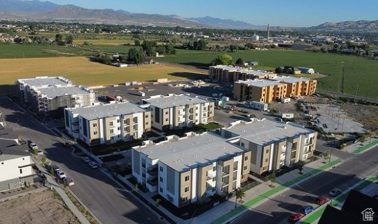 Birds eye view of property with a mountain view