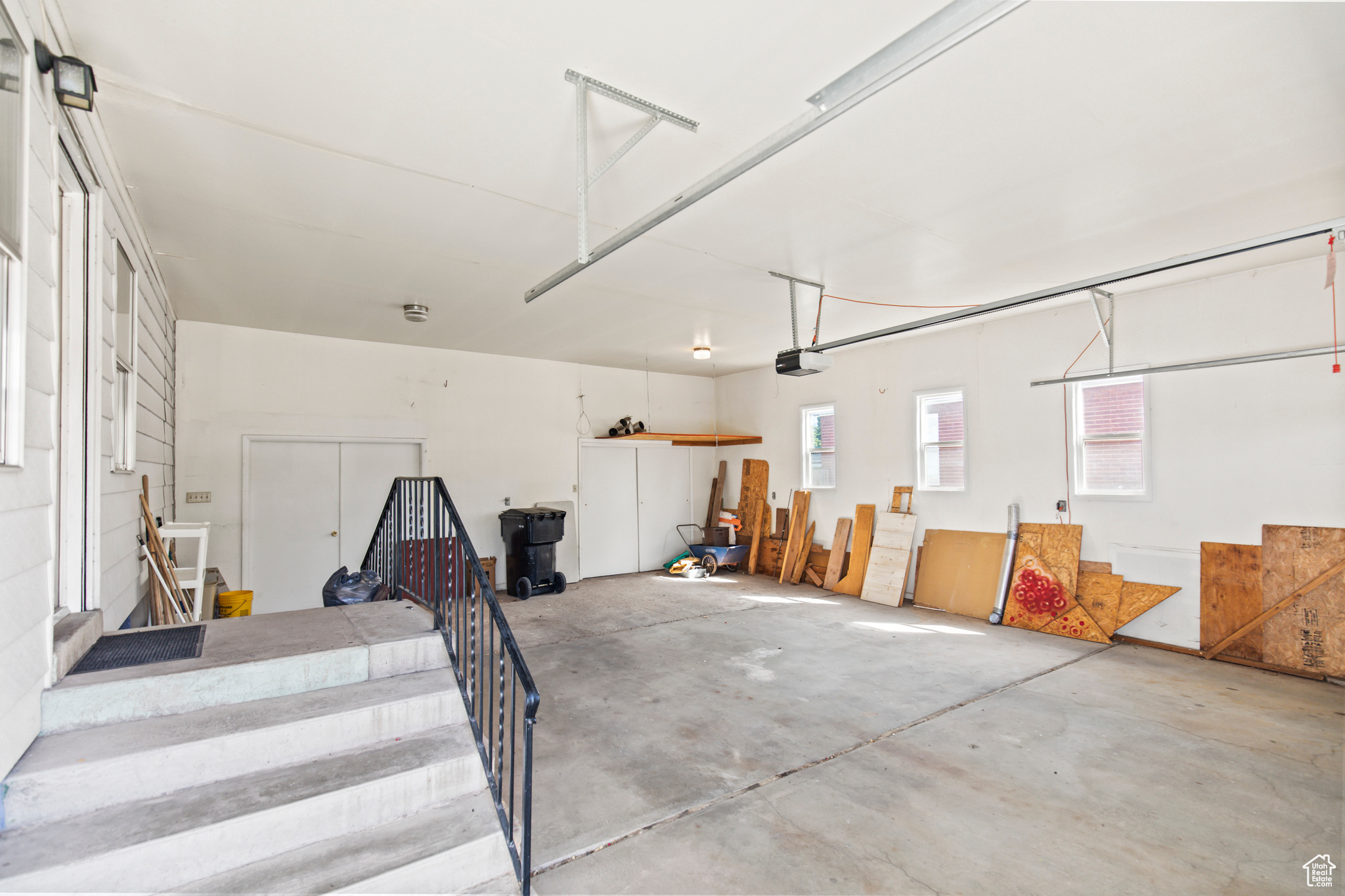 Garage featuring a garage door opener