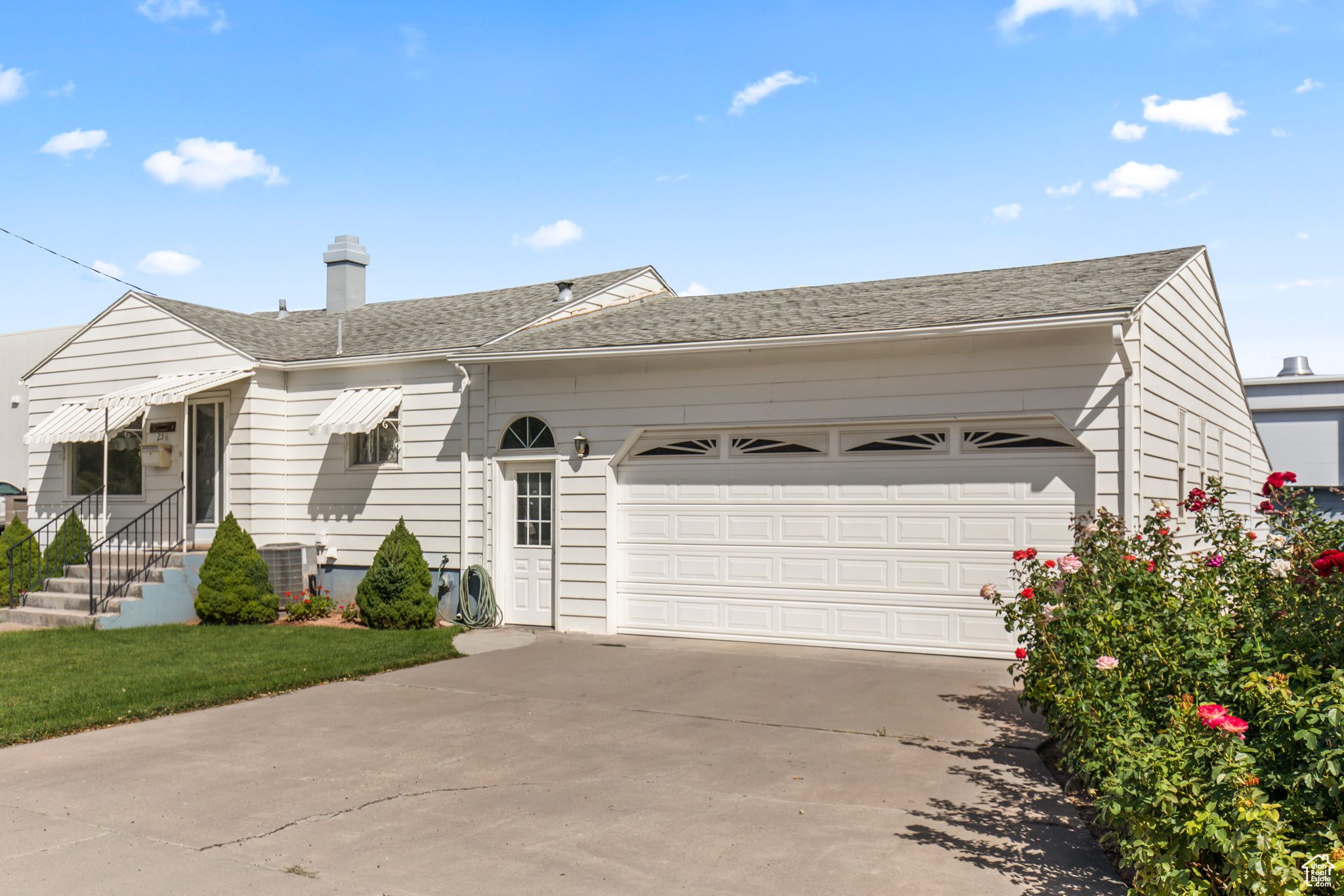 Ranch-style house with a garage and central AC