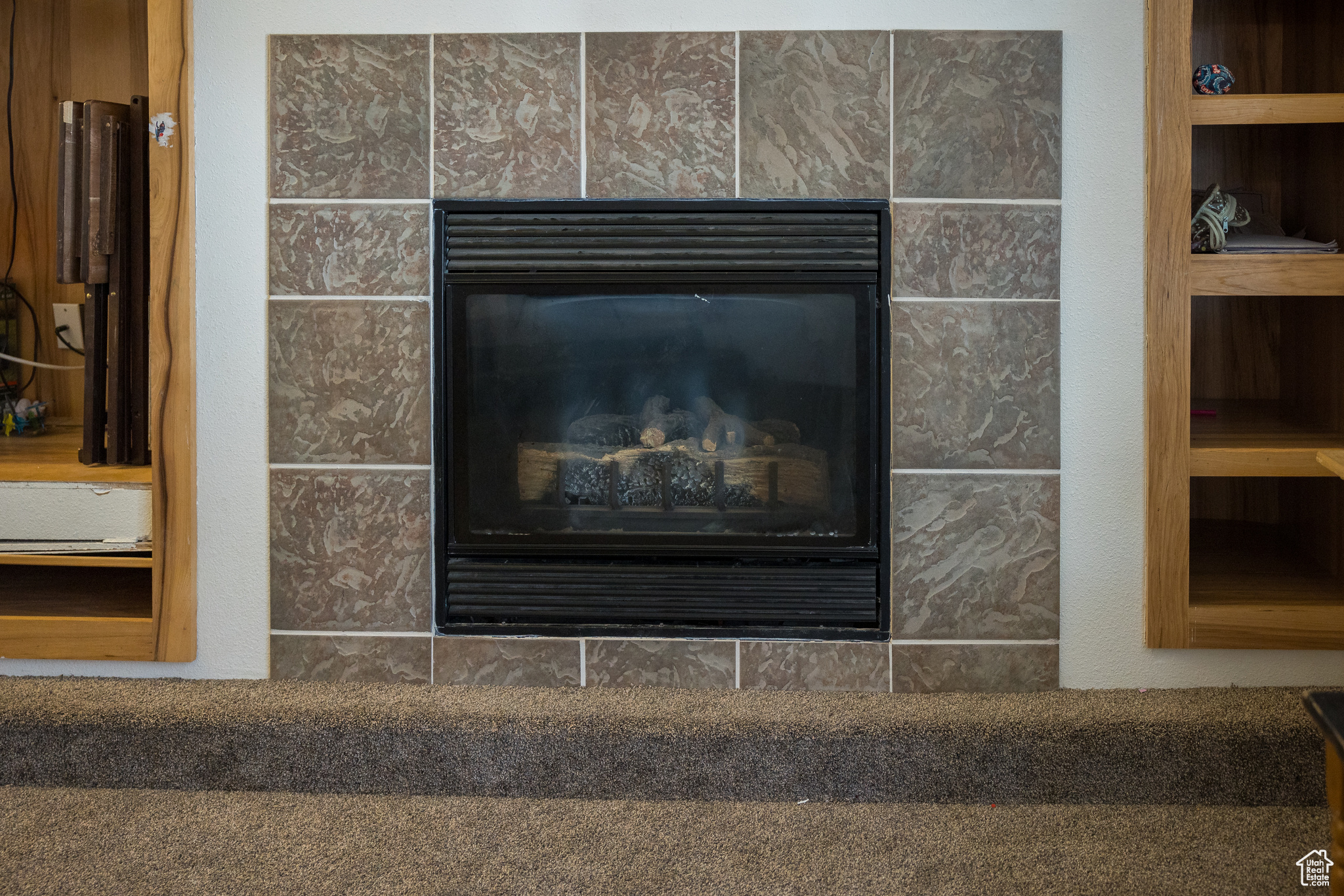 Room details with a fireplace and built in features