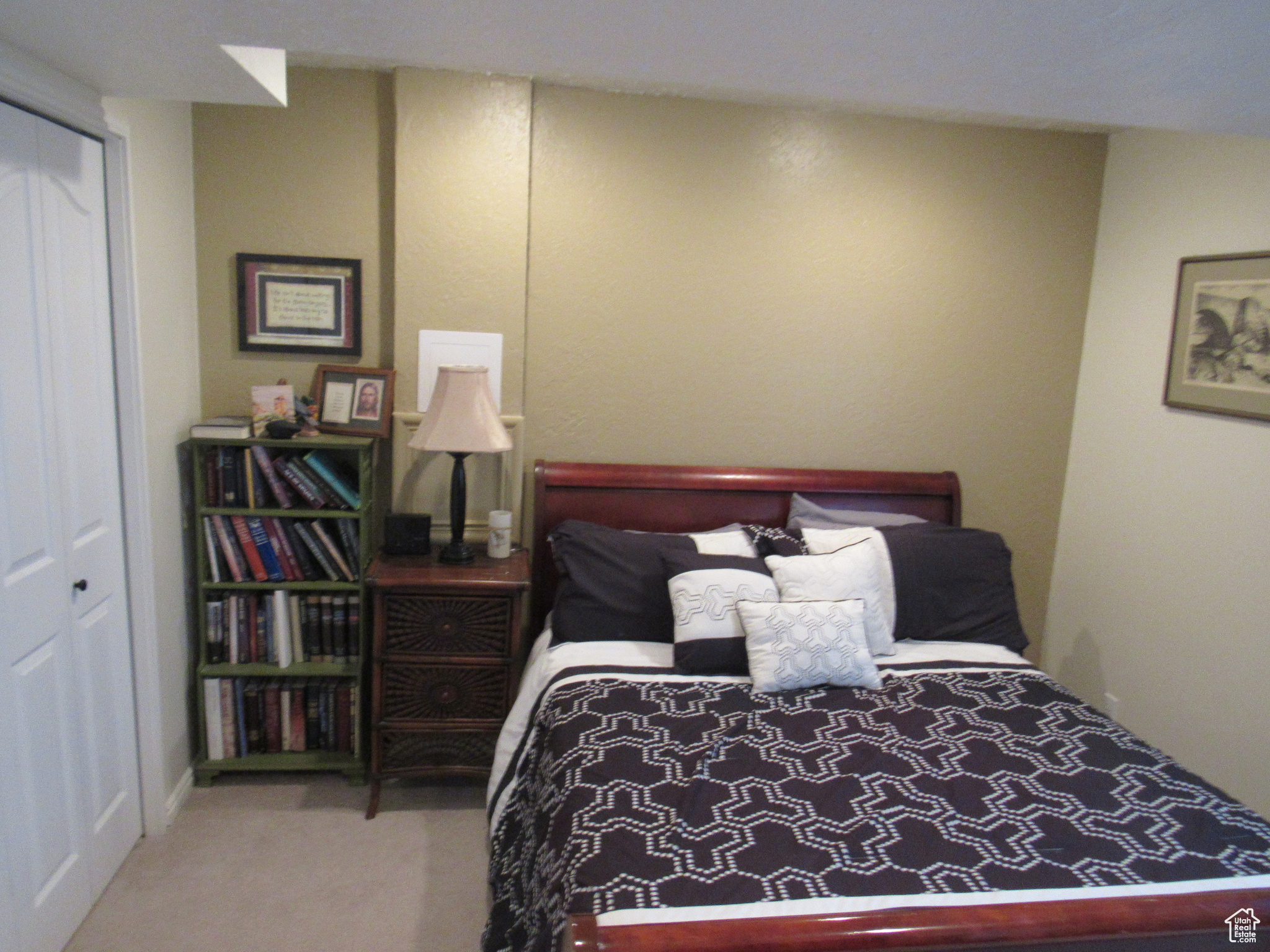 Carpeted bedroom featuring a closet