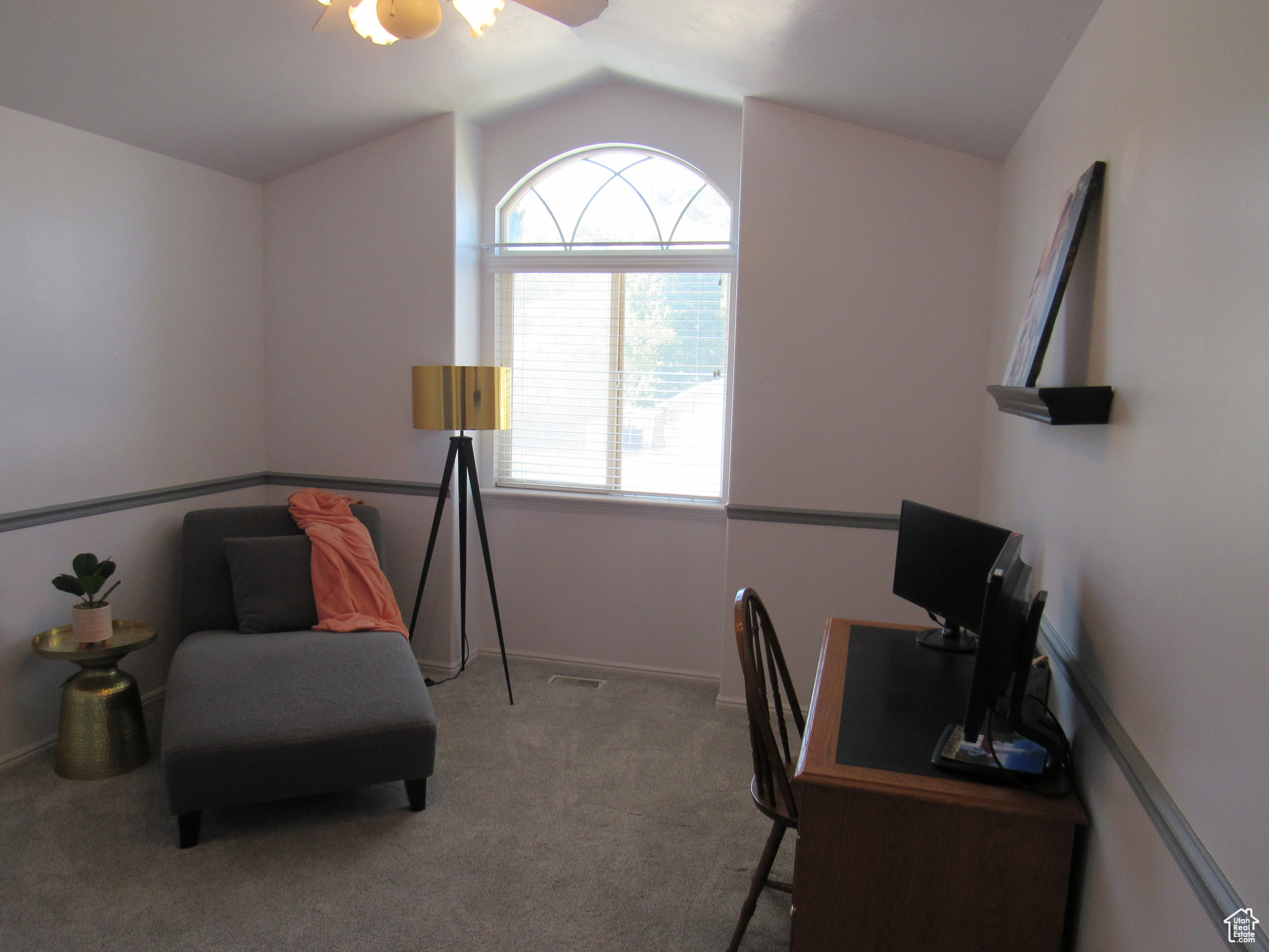 Office area with light colored carpet, lofted ceiling, and ceiling fan