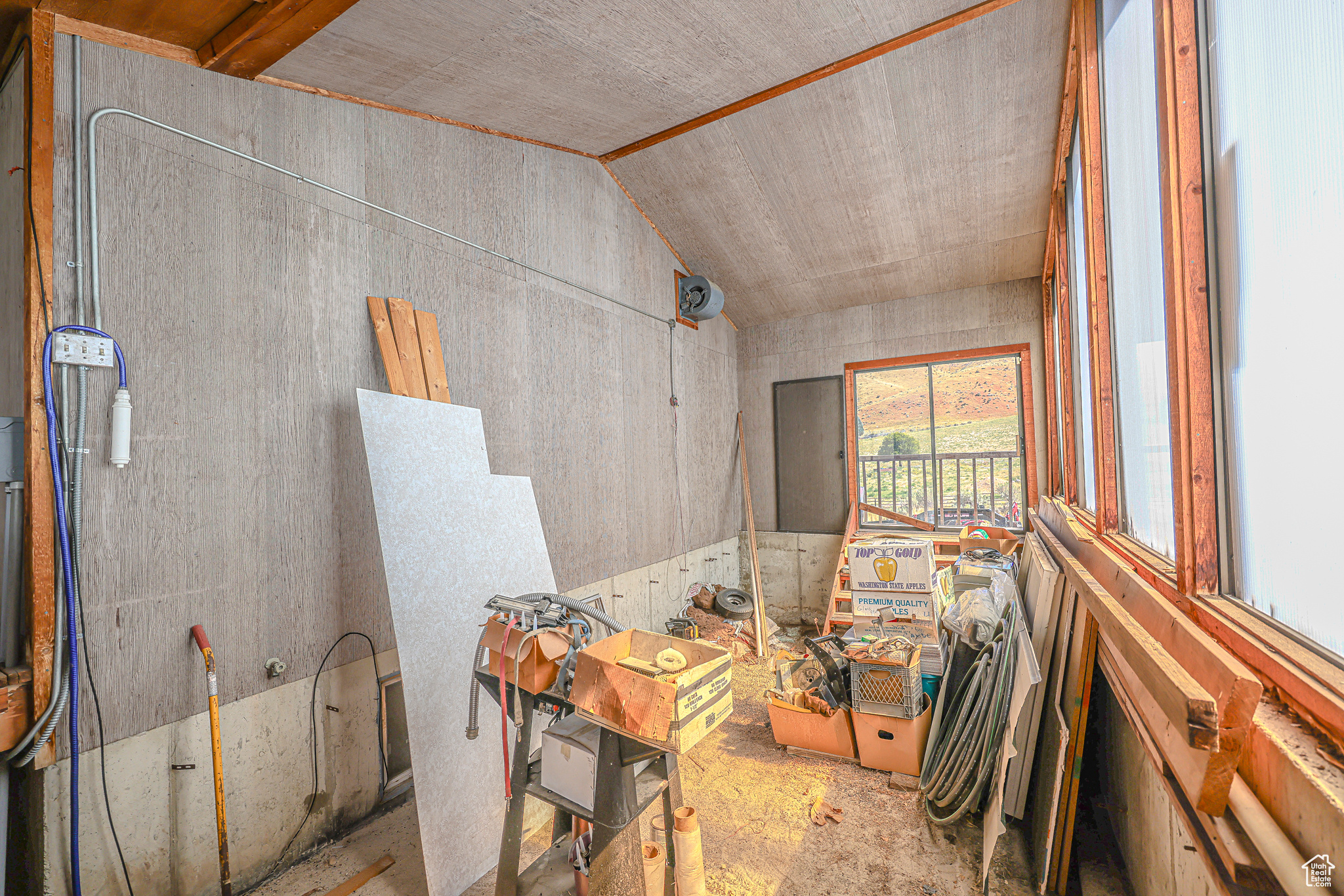 Miscellaneous room featuring vaulted ceiling