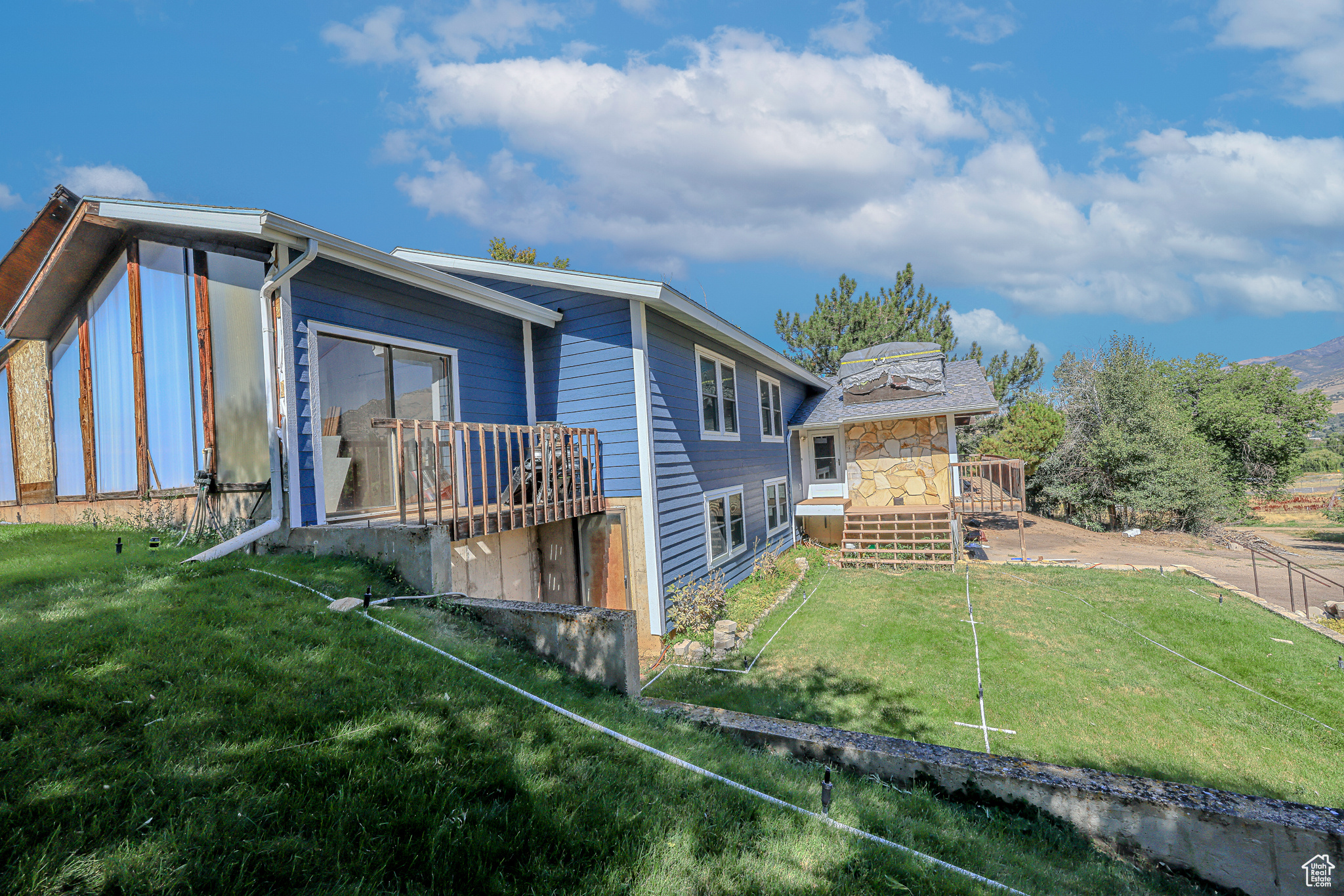 Rear view of property featuring a yard