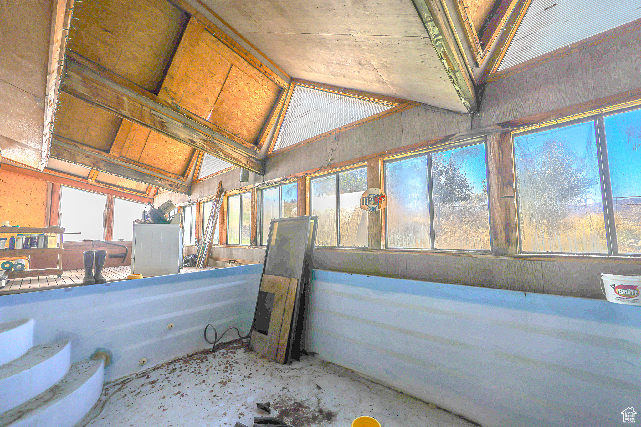 Interior space with plenty of natural light and vaulted ceiling