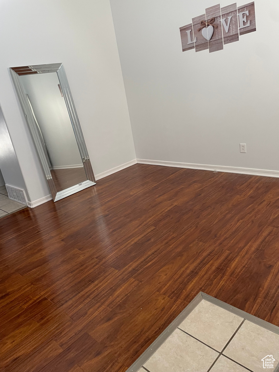 Spare room with hardwood / wood-style flooring