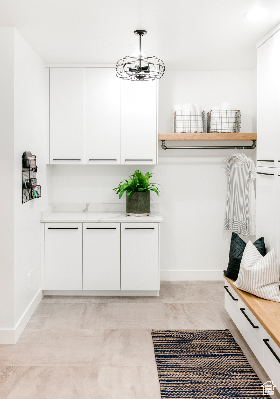 Mudroom with an inviting chandelier