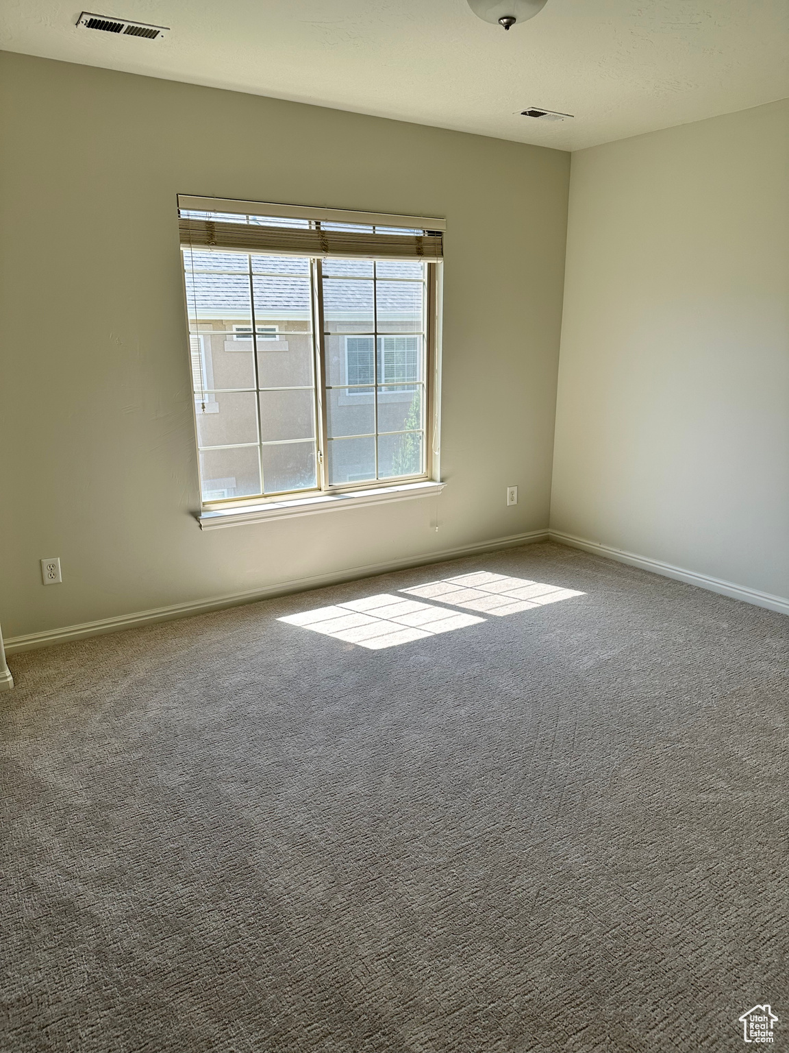 Empty room with carpet flooring