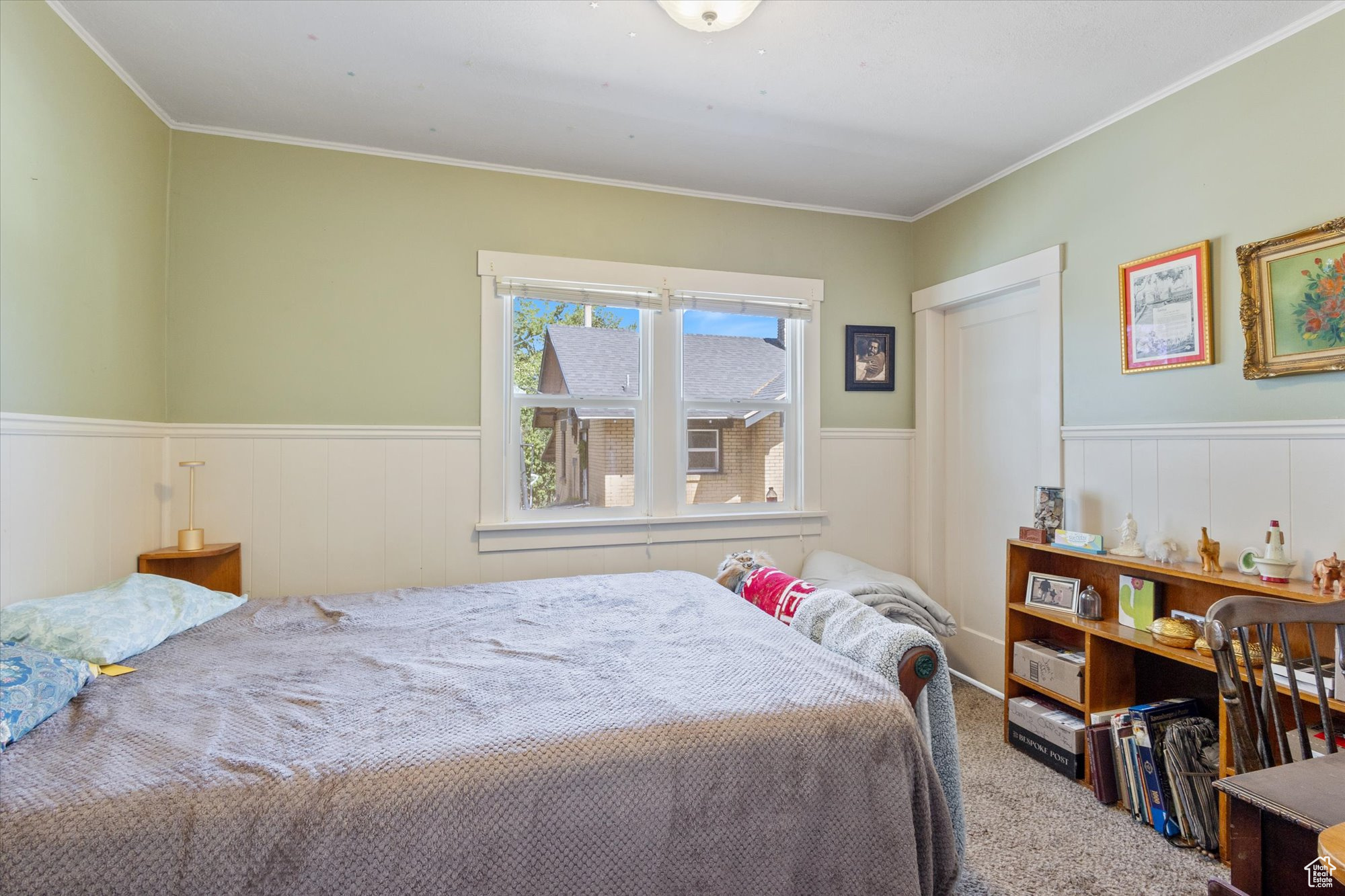 Bedroom featuring carpet flooring and ornamental molding