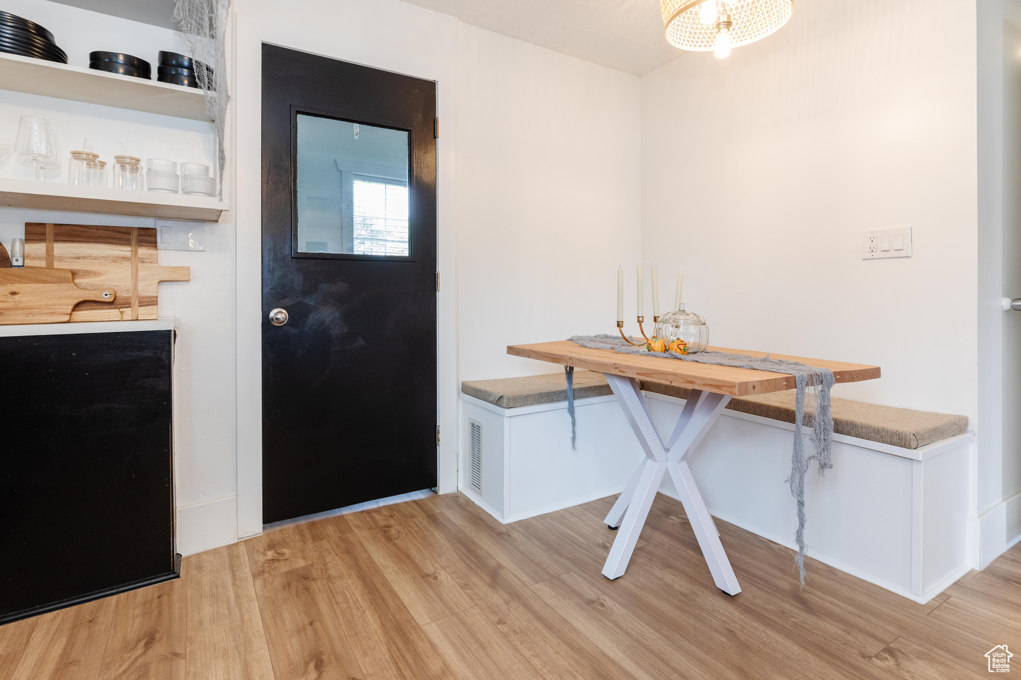 Dining space with light hardwood / wood-style floors