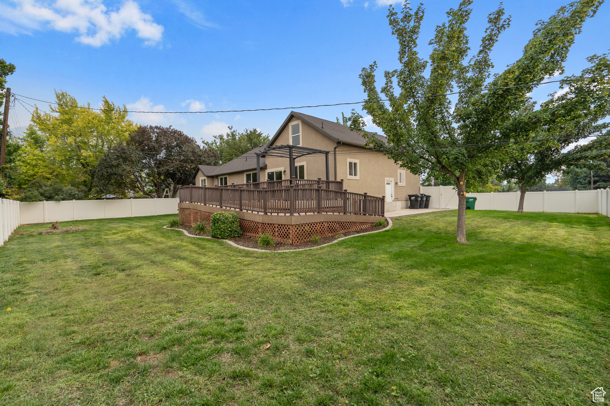 View of yard featuring a wooden deck