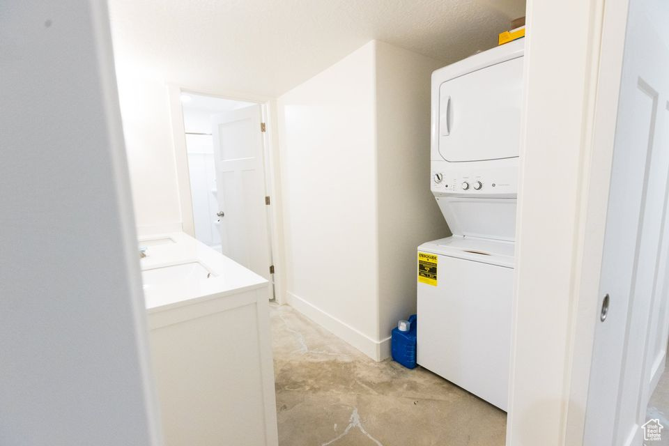 Clothes washing area with stacked washer / drying machine