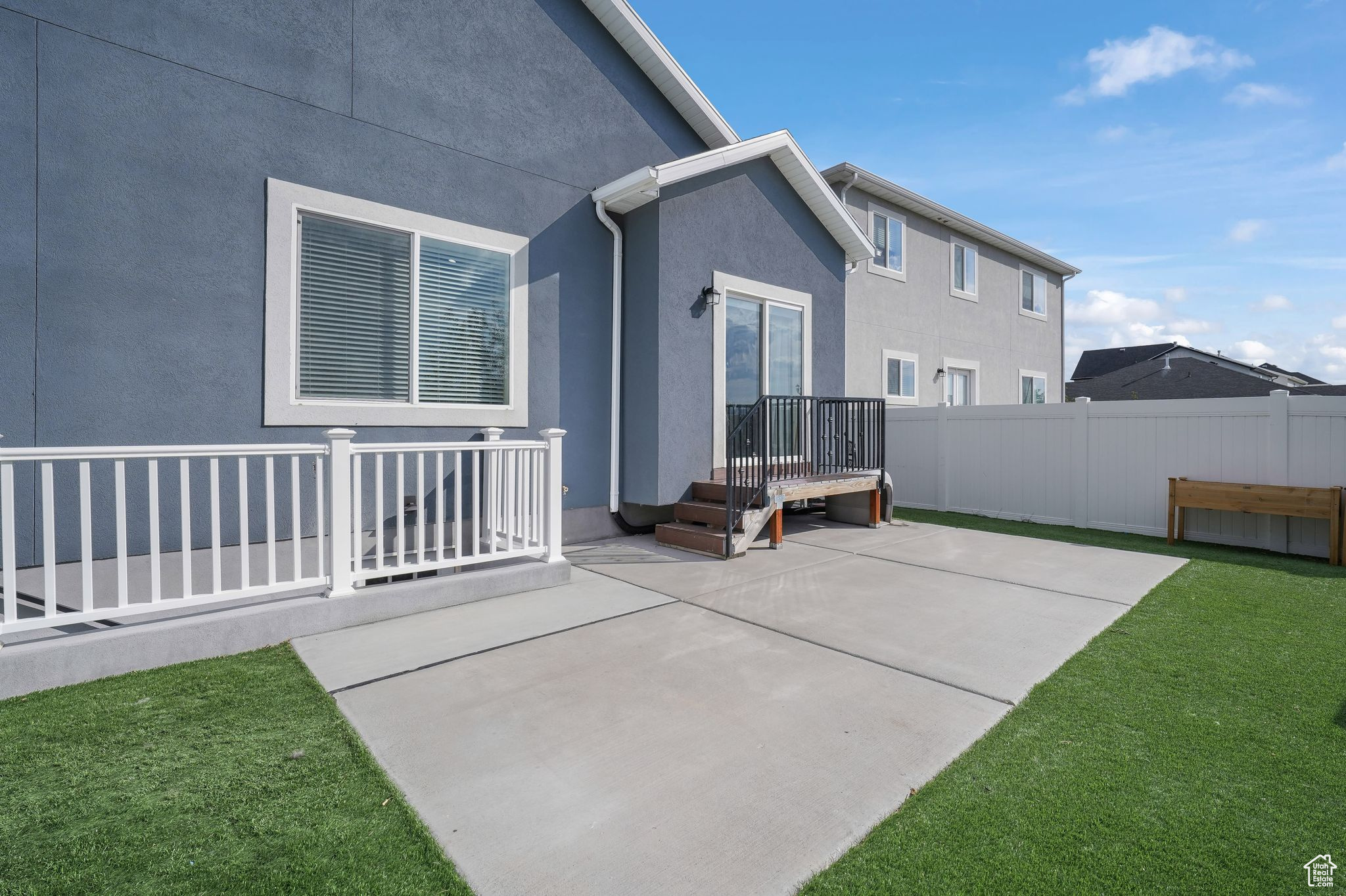 Exterior space with a yard and a patio area