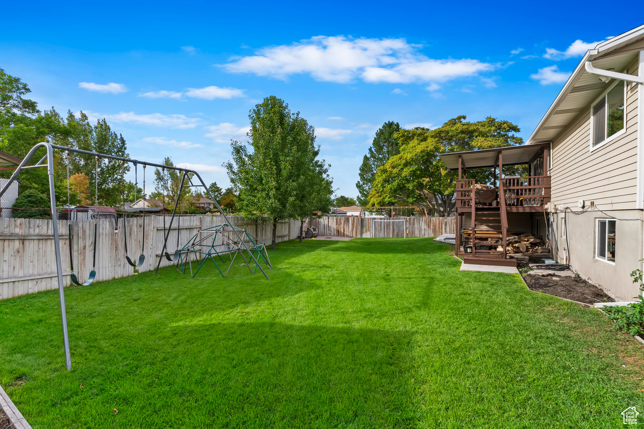 View of yard with a wooden deck