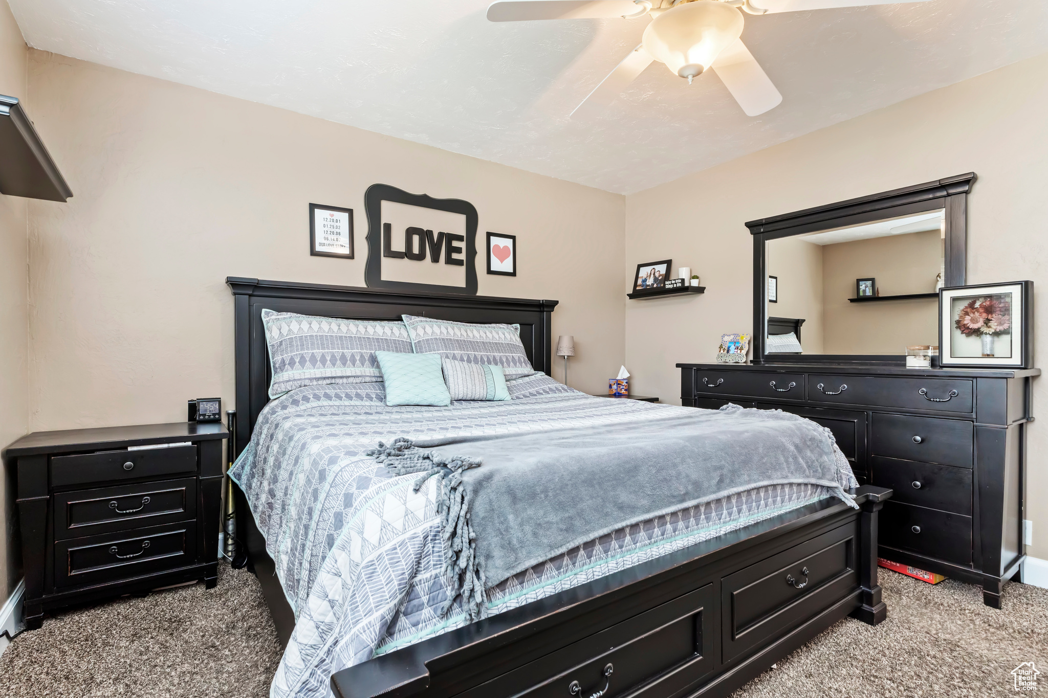 Bedroom featuring ceiling fan and light colored carpet