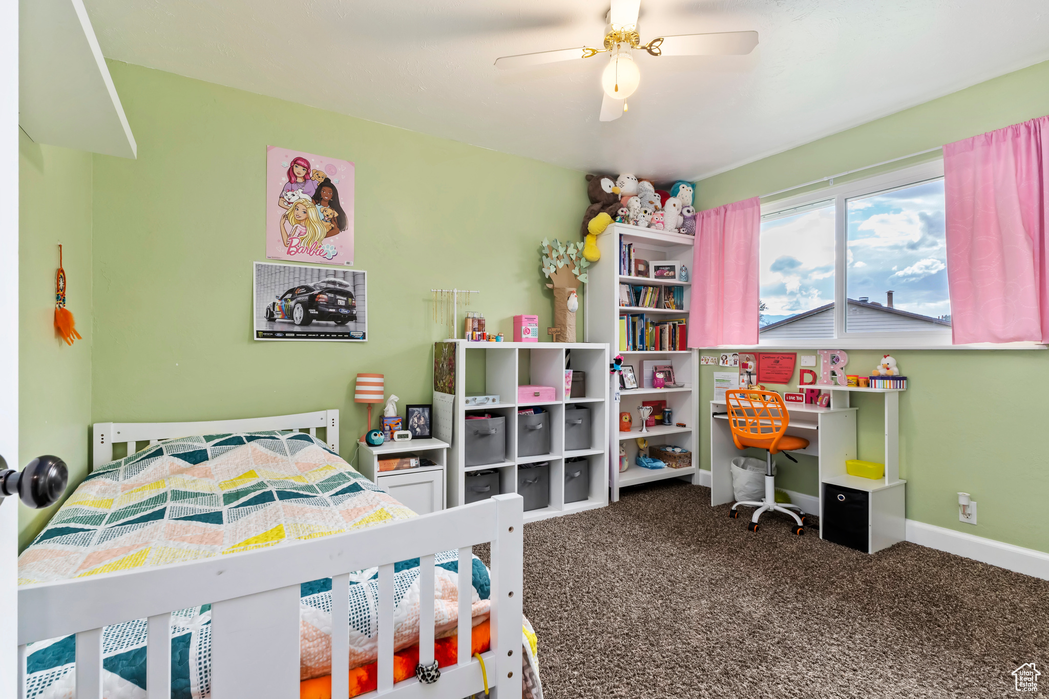 Bedroom featuring ceiling fan and carpet floors