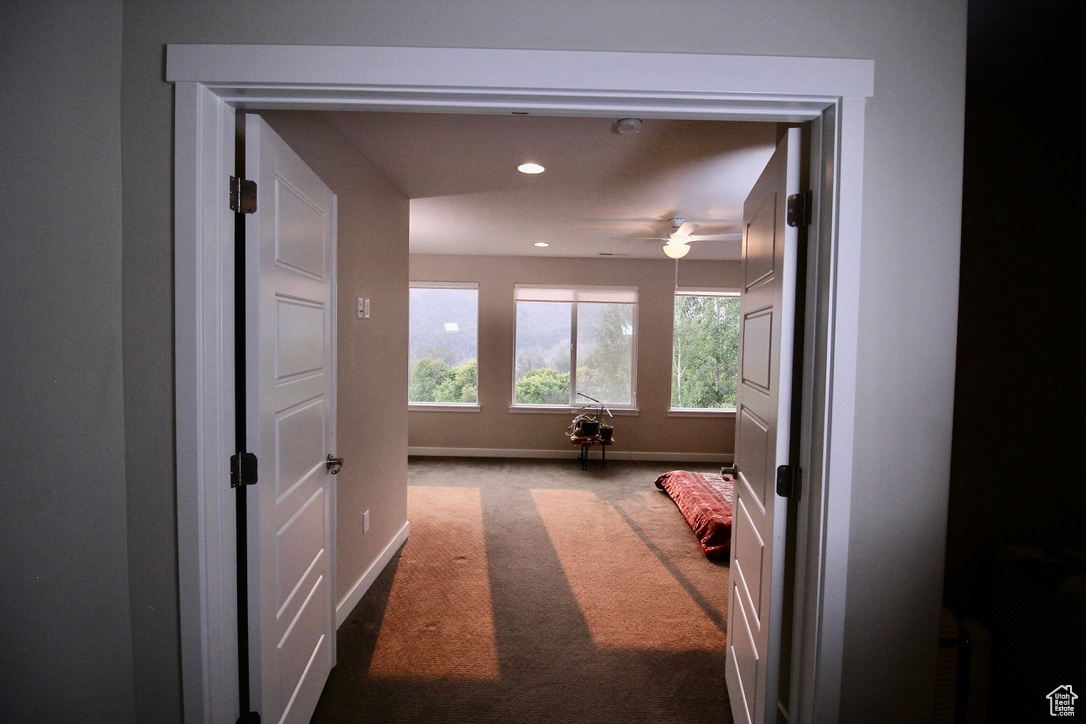 French doors invite you into the second-floor main bedroom which includes a vanity, toilet, shower, tub and walk-in closet.