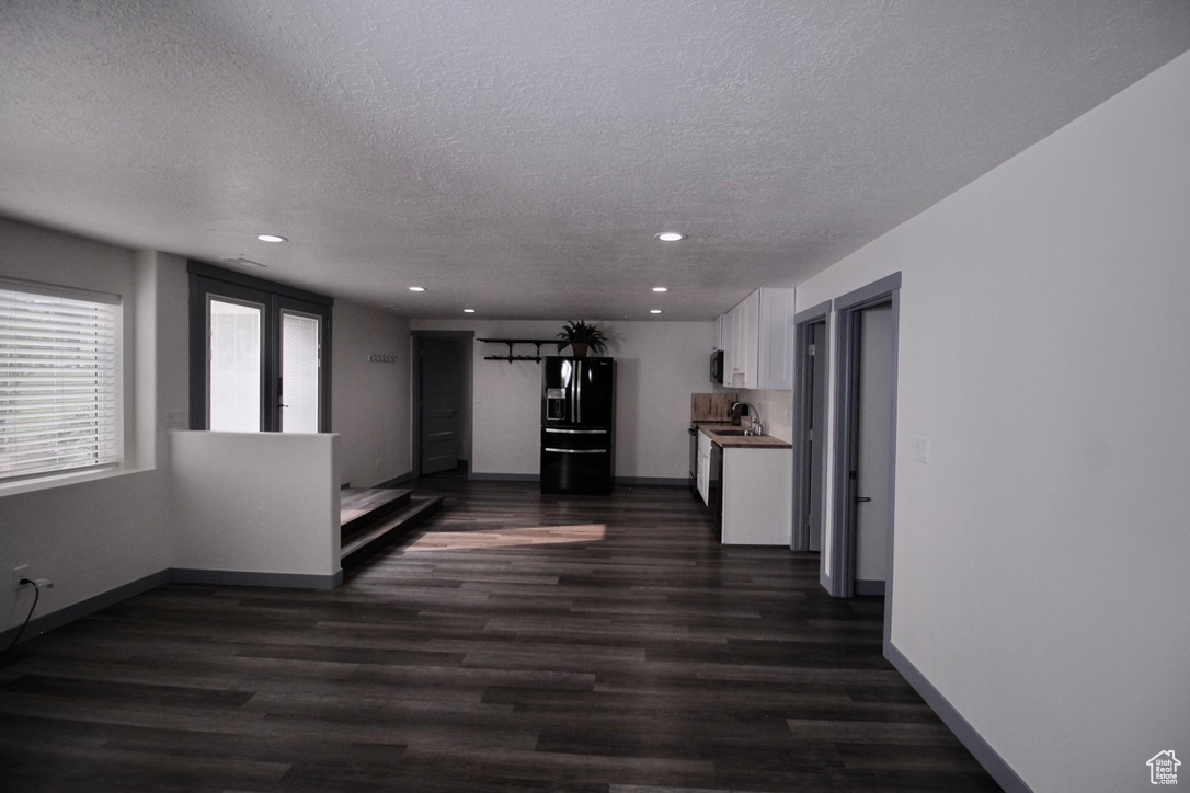 ADU space featuring a kitchen, bathroom/laundry combo. Bask in natural light in this unit with two walk-out entrances.