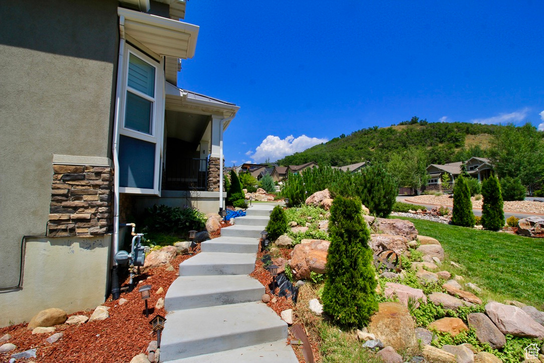 A professionally landscaped yard is an inviting entrance to this lovely home.