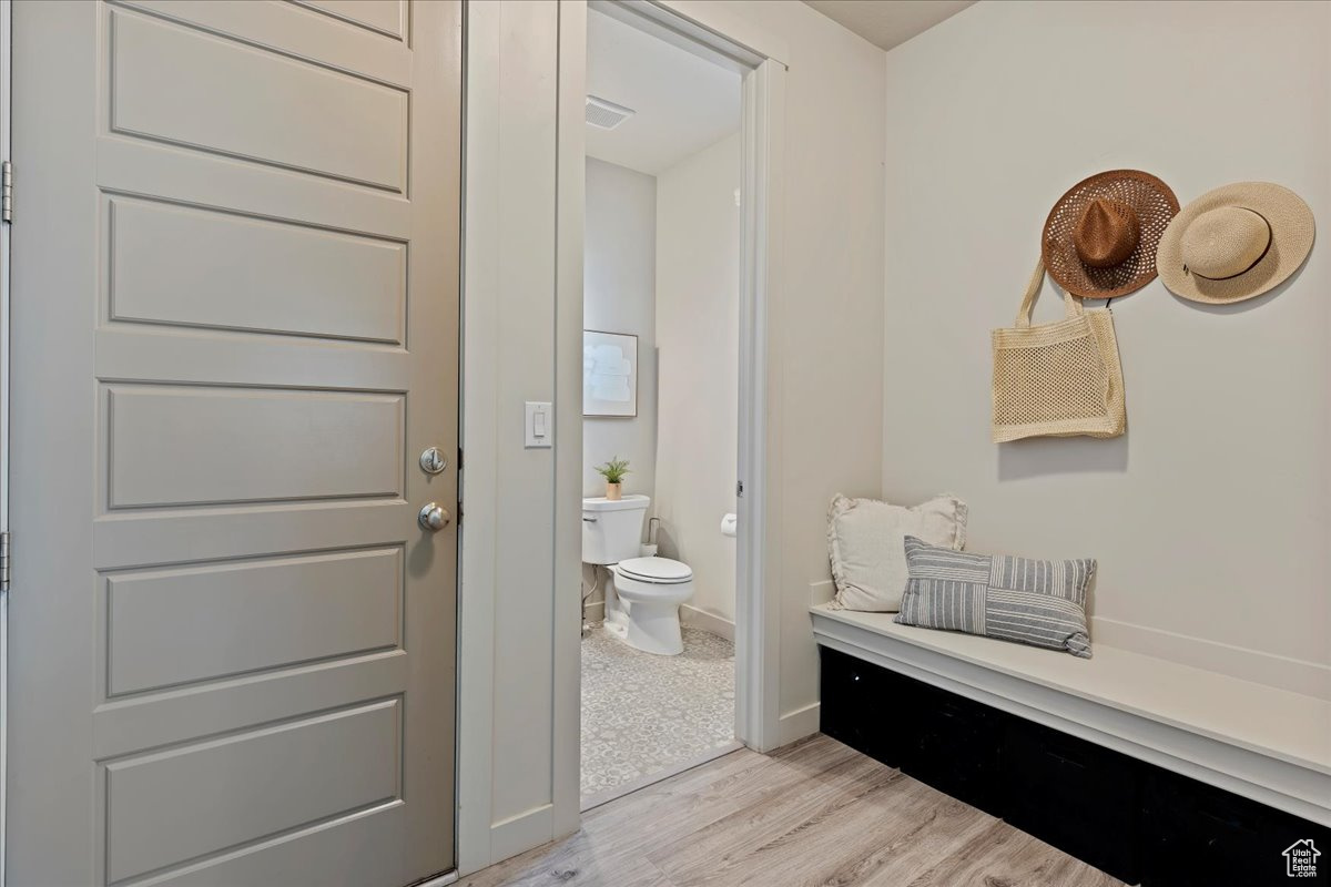 Mud room with garage access and half bath