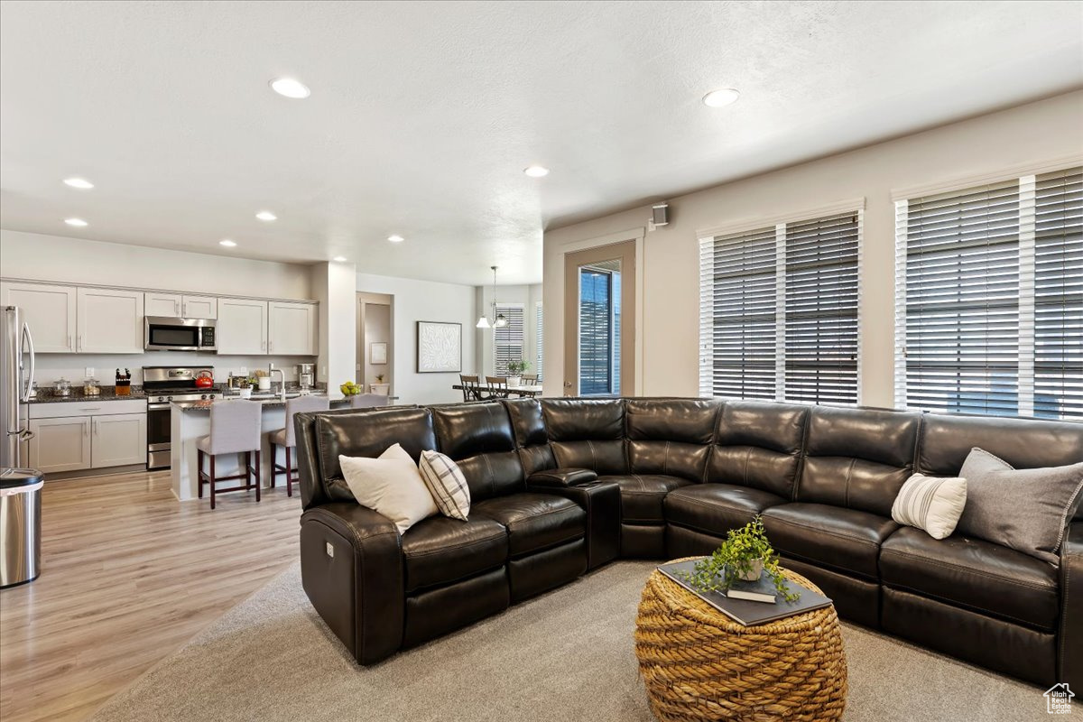 Family room with brand new carpet and wiring for surround sound speakers (not included)