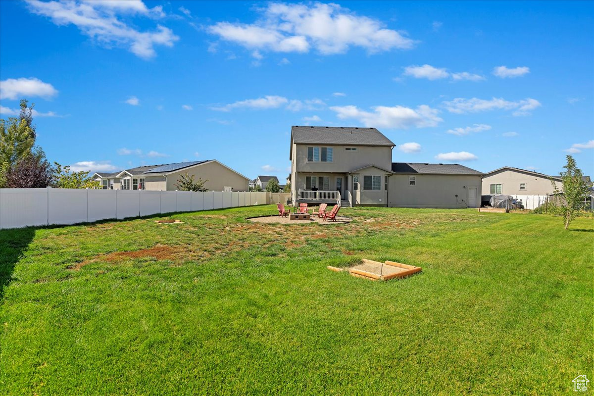 HUGE backyard with horseshoe pits, fire pit, and garden