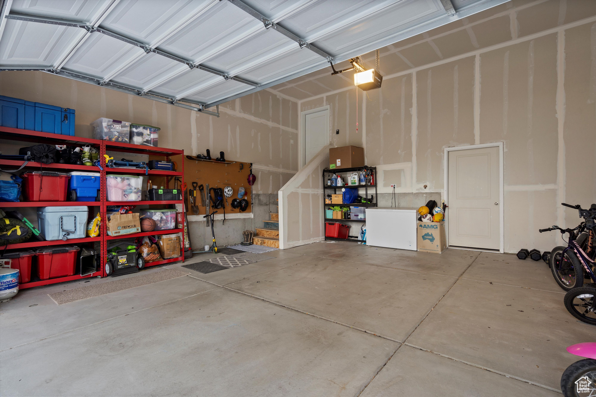 Garage featuring a garage door opener